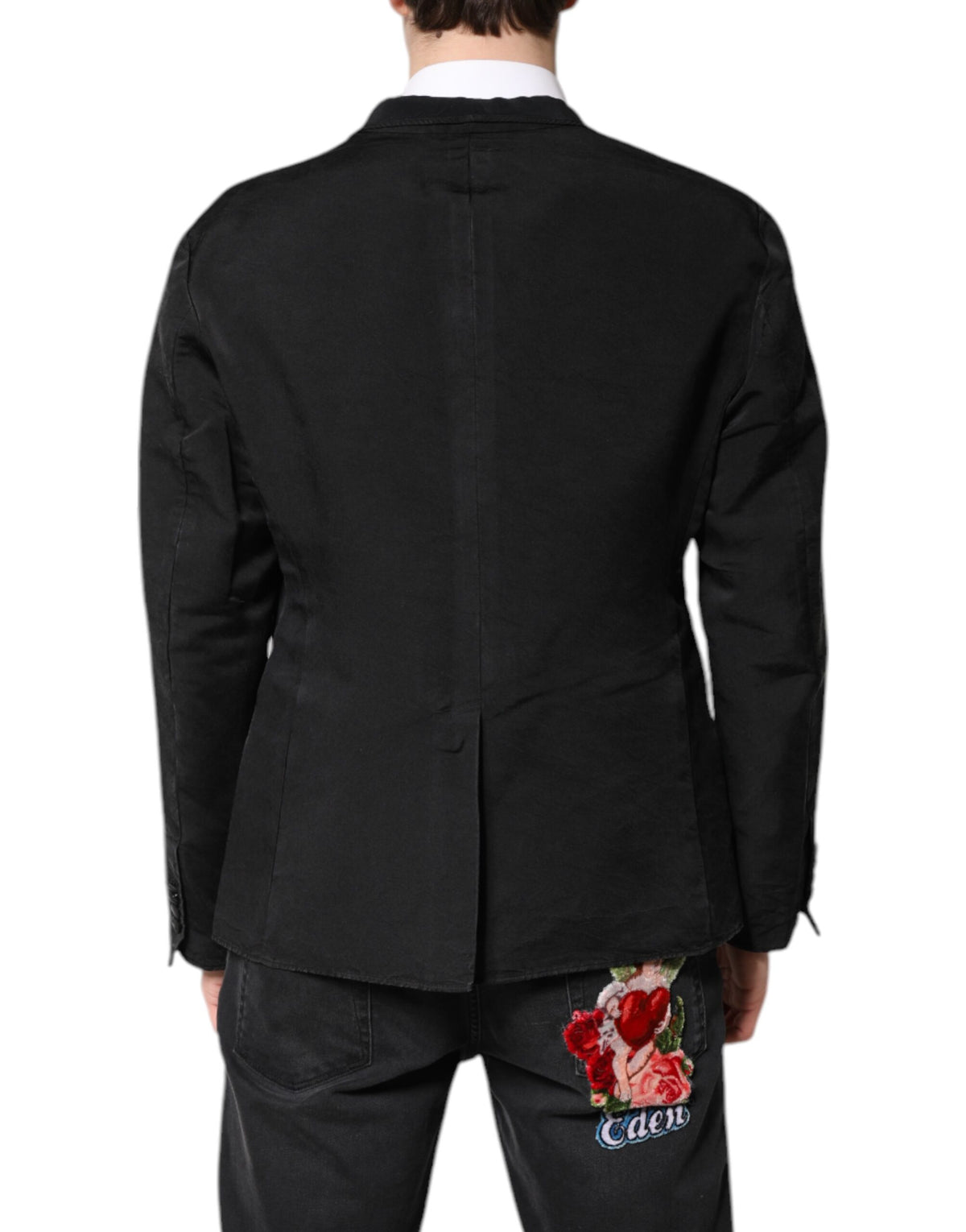 Elevate your wardrobe with the Dolce & Gabbana Black Silk Single Breasted Coat Blazer Suit, a timeless piece of exquisite craftsmanship that embodies luxury and sophistication.