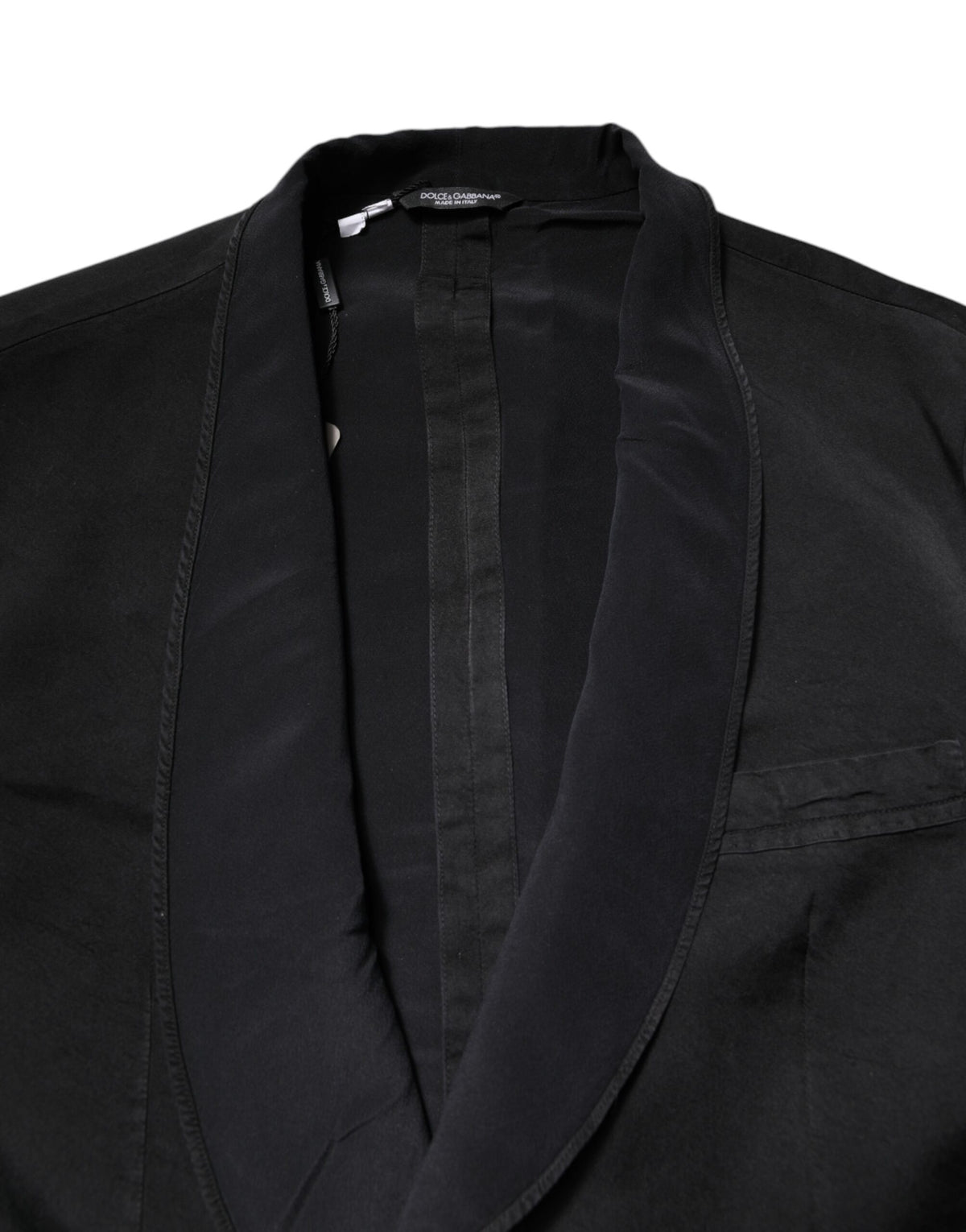 Indulge in the exquisite Dolce & Gabbana Black Silk Single Breasted Coat Blazer Suit, a timeless piece crafted from luxurious silk, embodying elegance and sophistication for any occasion.