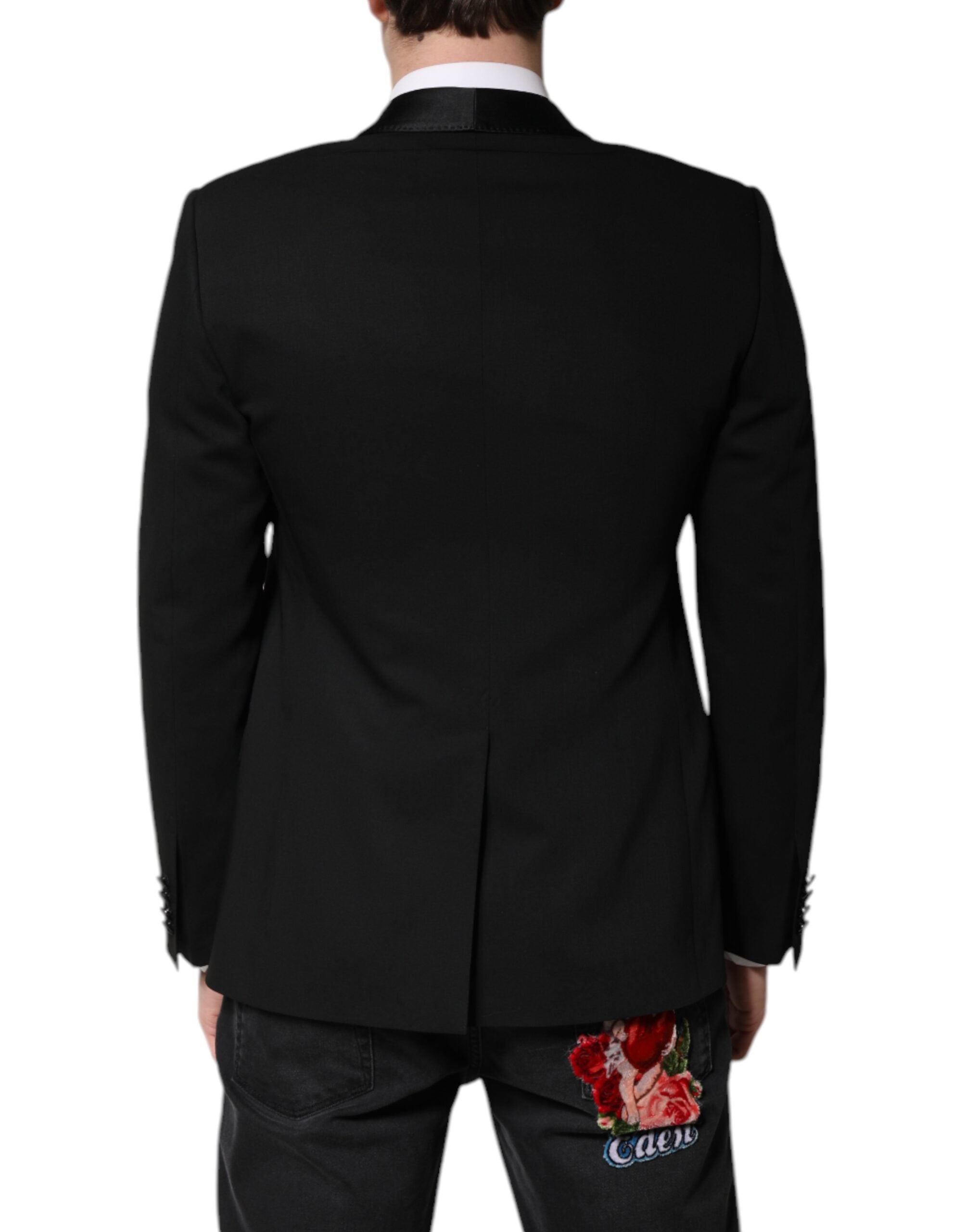 Experience the allure of Dolce & Gabbana's Black MARTINI Blazer, crafted from luxurious virgin wool and silk, epitomizing refined elegance for discerning tastes.