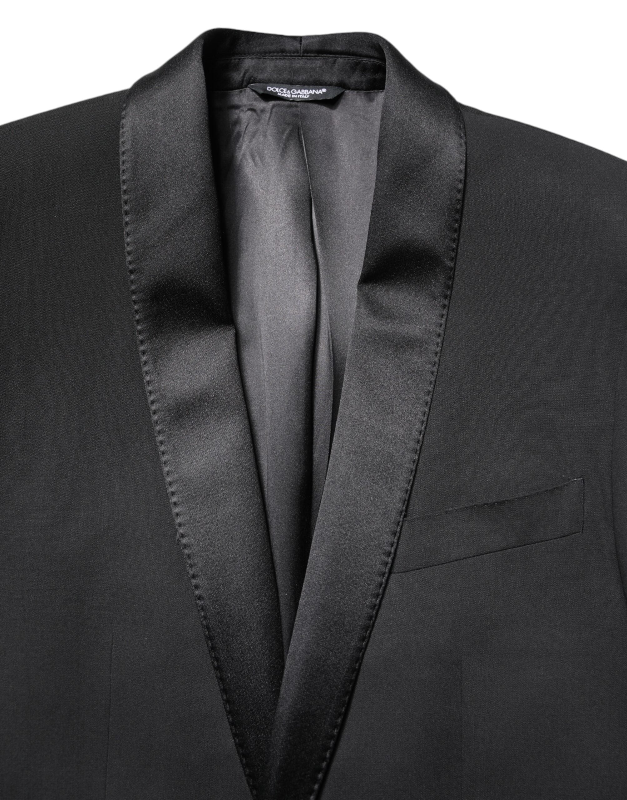 Experience the exquisite Dolce & Gabbana Black MARTINI Blazer, crafted from luxurious virgin wool and silk, embodying sophistication and timeless elegance for the discerning individual.