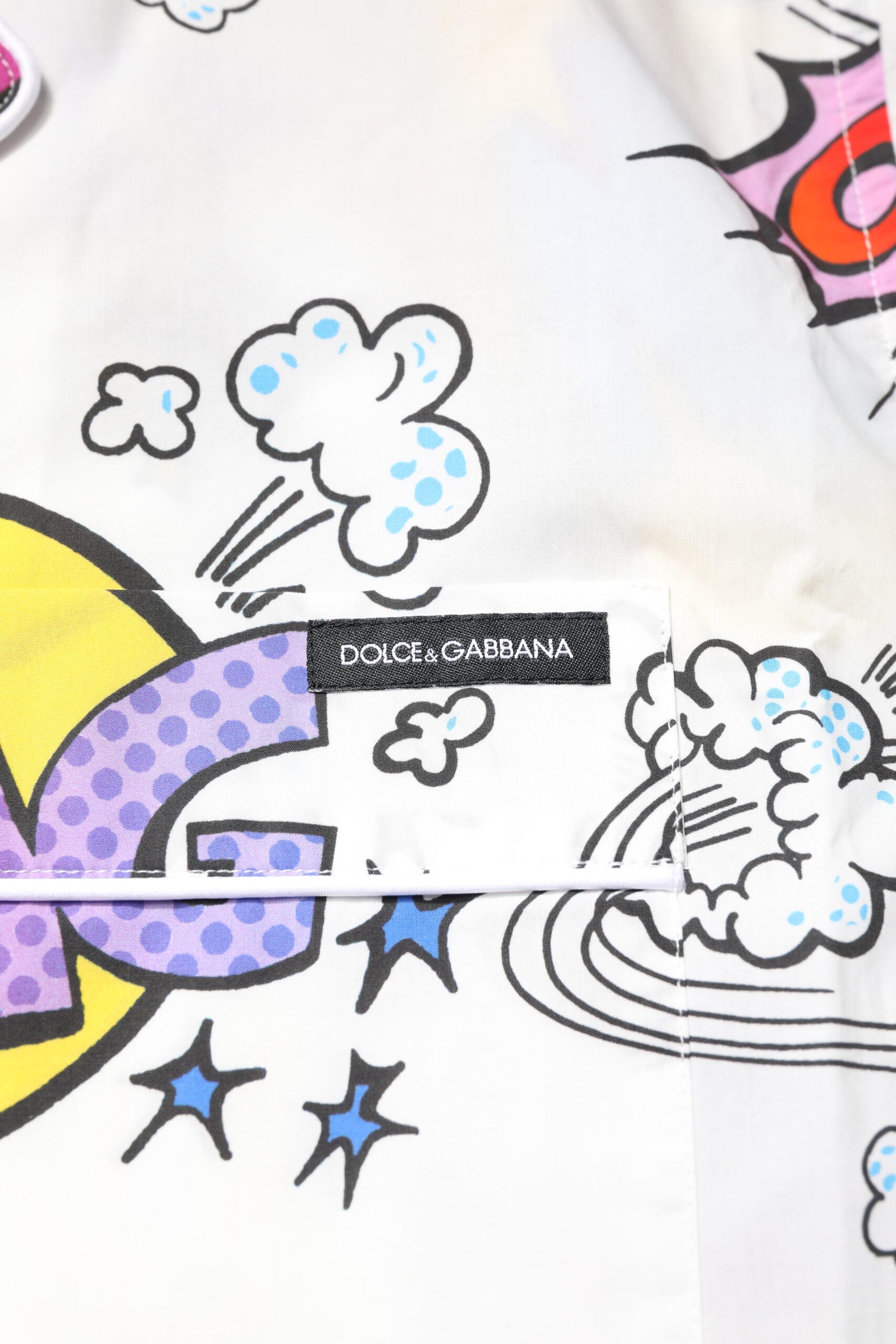 Elevate your loungewear with the Dolce & Gabbana White Cartoon Print Cotton Men Pajama Set, a fusion of playful elegance and Italian craftsmanship for the discerning individual.