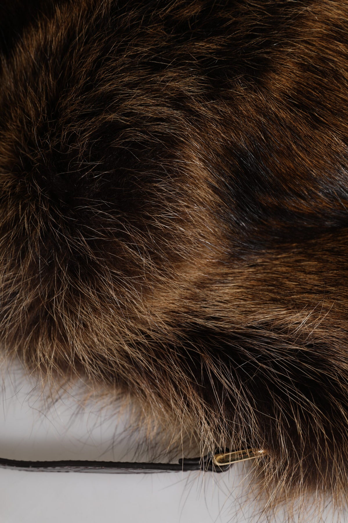 Indulge in the exquisite Dolce & Gabbana Brown Fur Women Bucket Hat, a masterpiece of artisanal luxury crafted from raccoon fur and caiman skin, perfect for elevating any ensemble.