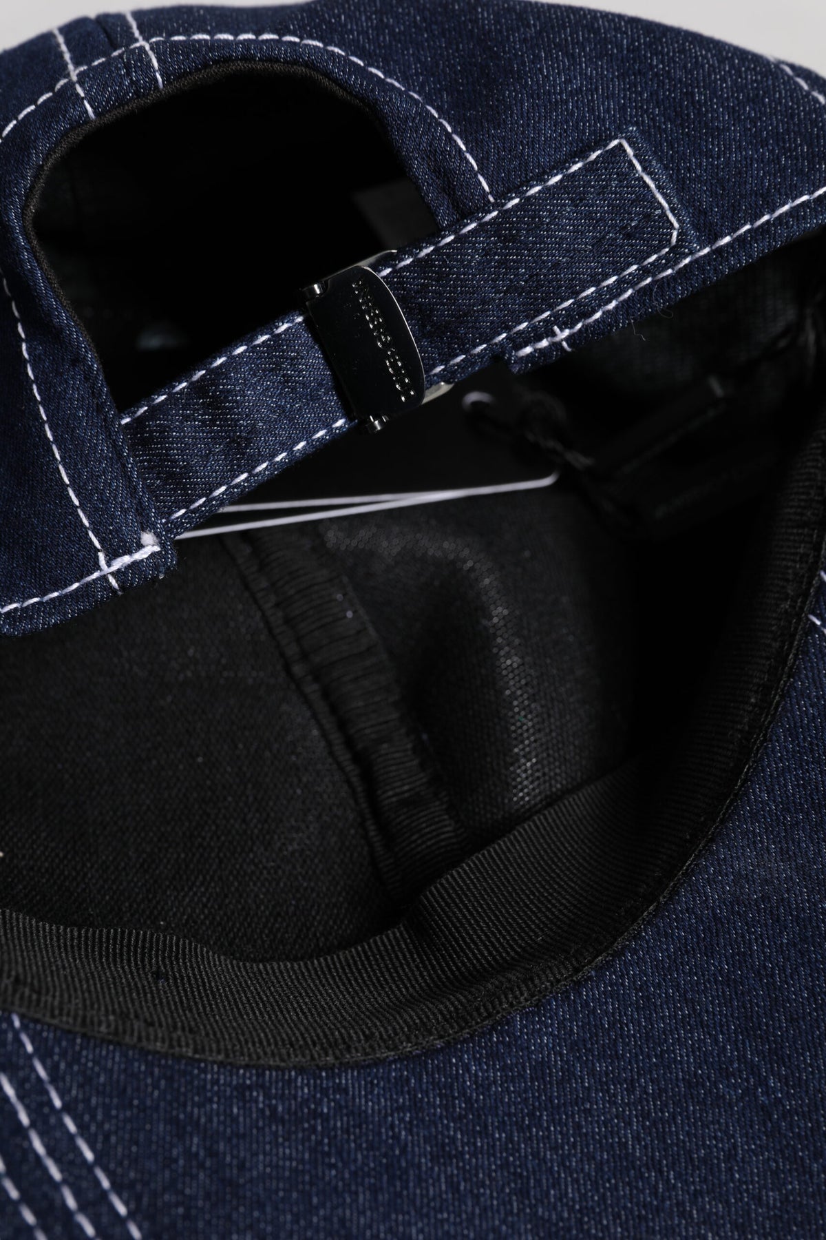Elevate your style with the Dolce & Gabbana Blue Crystal Embellishment Baseball Cap, a masterpiece of Italian craftsmanship blending luxury and urban elegance for the discerning individual.