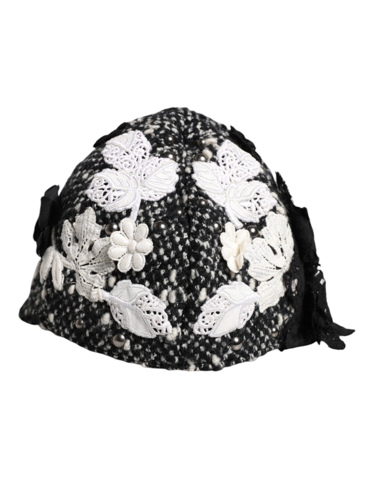 Discover the Dolce & Gabbana Black Wool White Floral Embellished Cloche Hat, a masterpiece of artisan craftsmanship that elevates your style with timeless elegance and luxurious allure.