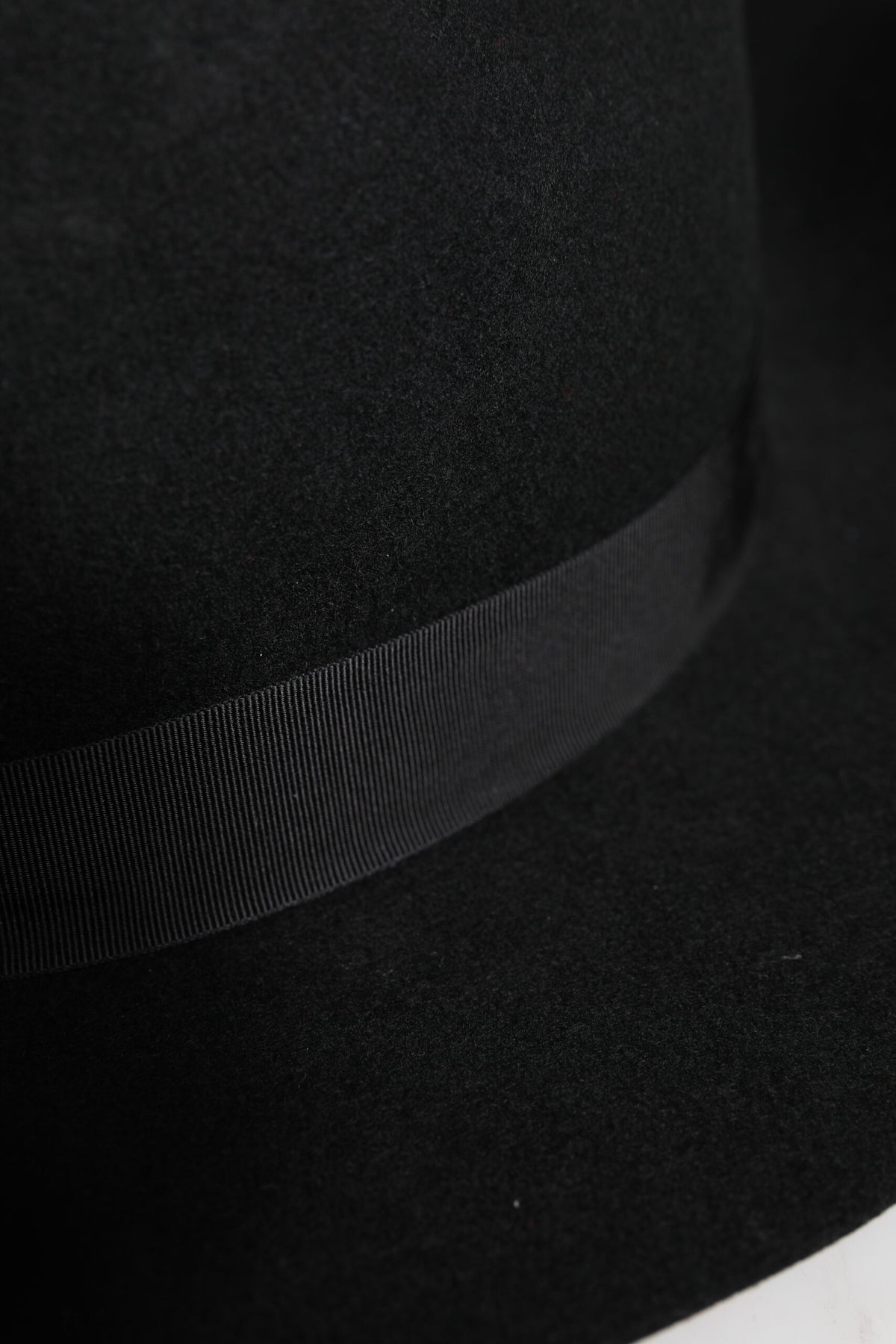 Indulge in the artisanal elegance of the Dolce & Gabbana Black Wide Brim Trilby Fedora Hat, a timeless accessory crafted from premium wool felt, perfect for the discerning individual.