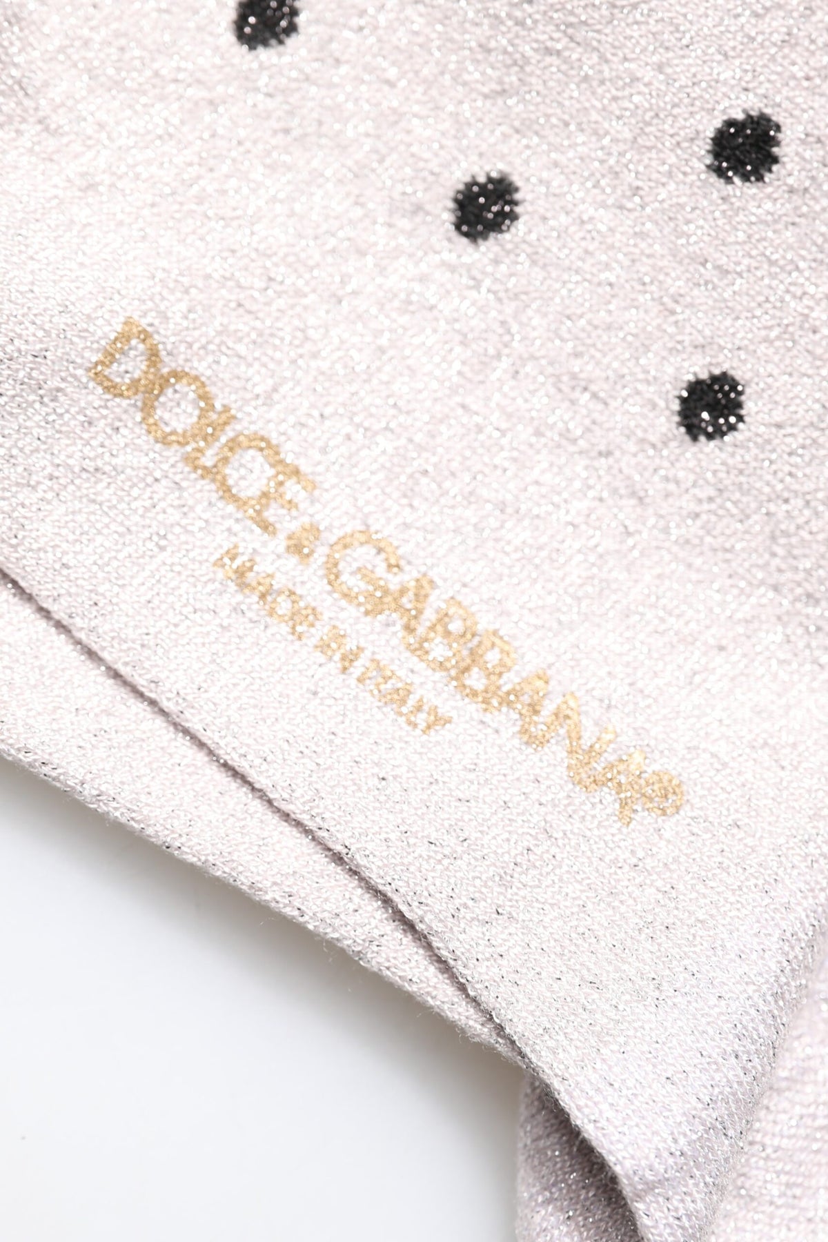 Indulge in the luxurious Dolce & Gabbana Gray Viscose Stretch Dotted Socks, crafted in Italy with exquisite materials, embodying elegance and refined style for the discerning individual.