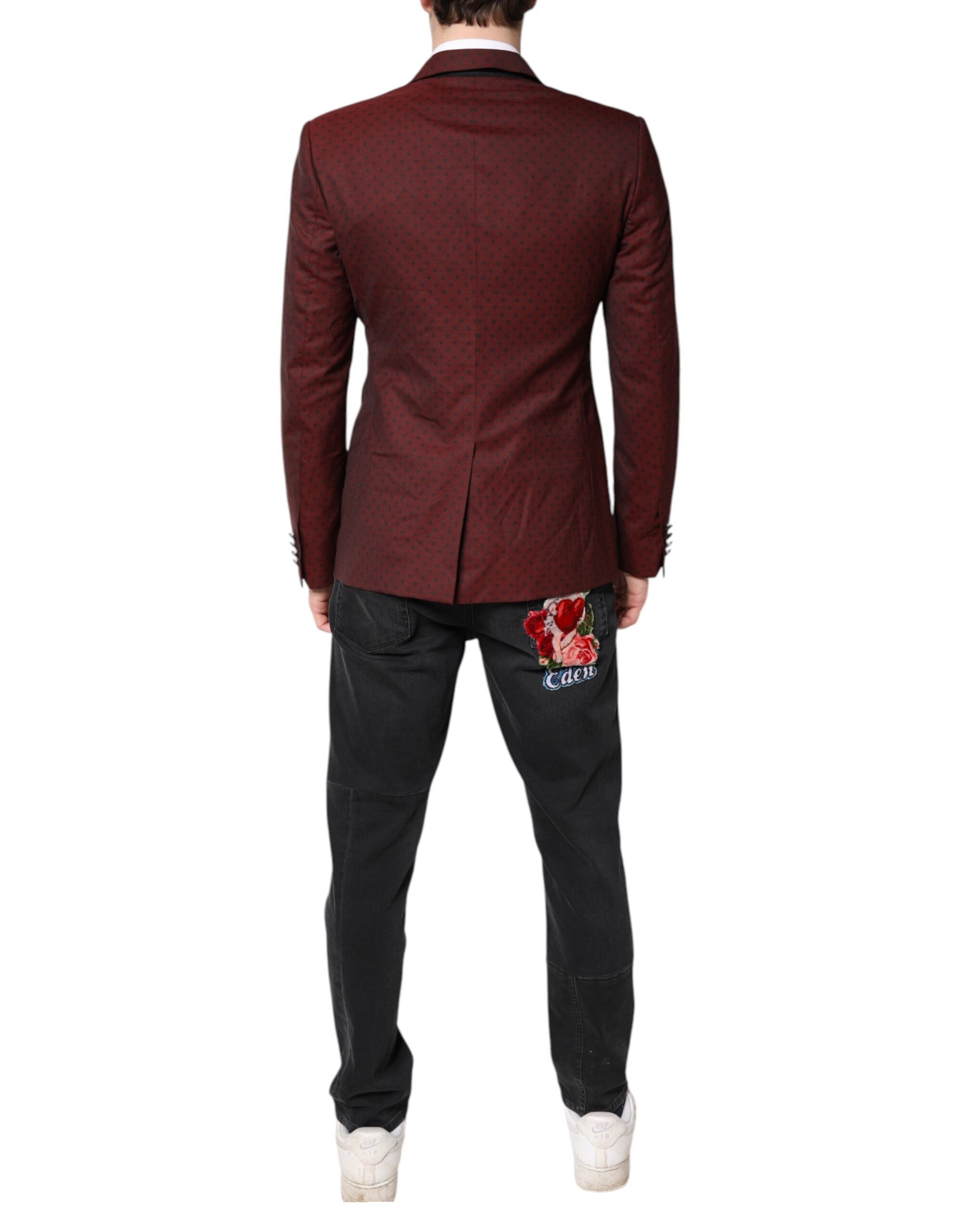 Experience the exquisite elegance of the Dolce & Gabbana Maroon Wool Slim Fit Blazer, a masterpiece of Italian craftsmanship that redefines luxury for the discerning individual.