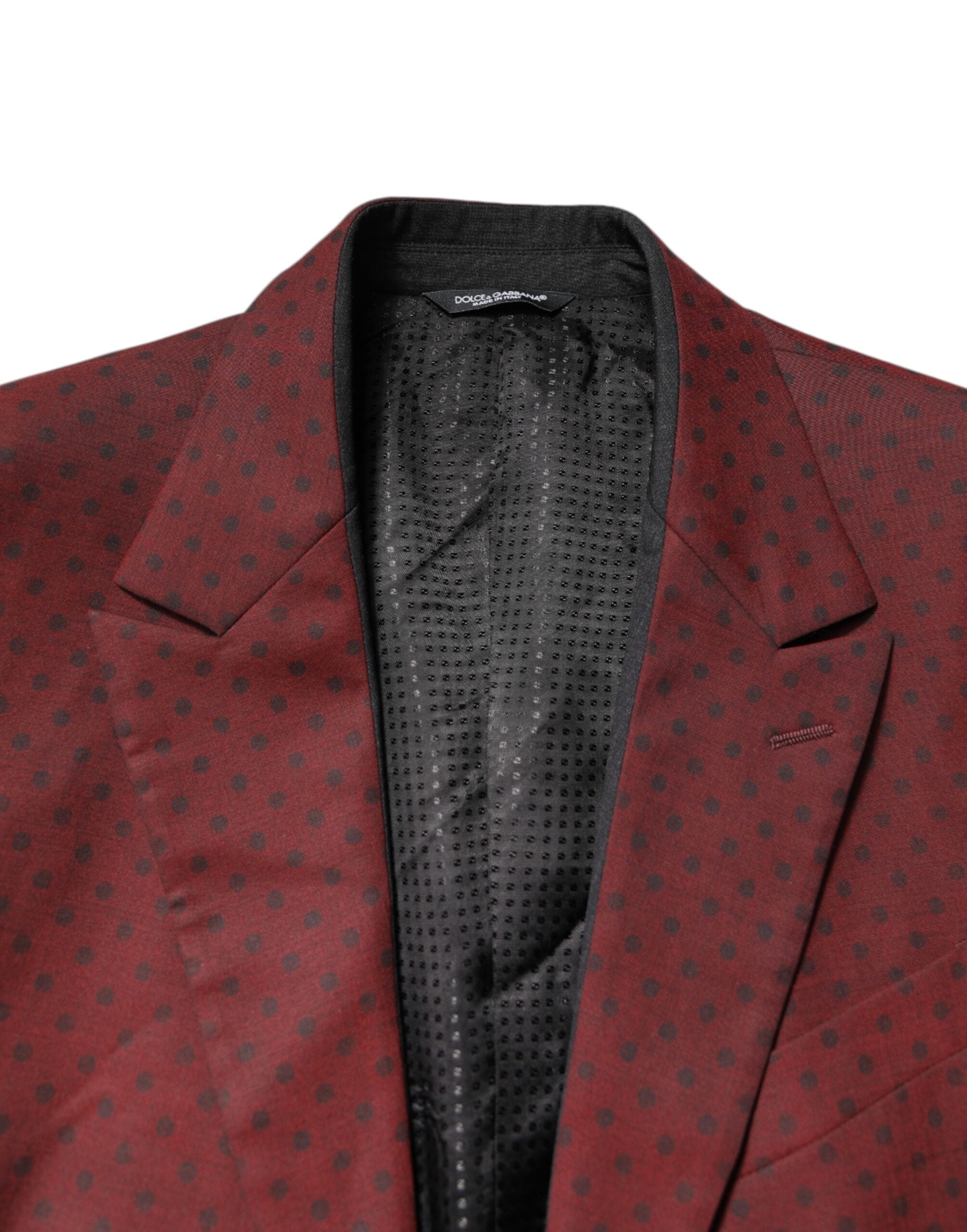 Discover the Dolce & Gabbana Maroon Wool Slim Fit Blazer, a masterpiece of Italian craftsmanship, blending luxurious materials for the discerning individual.