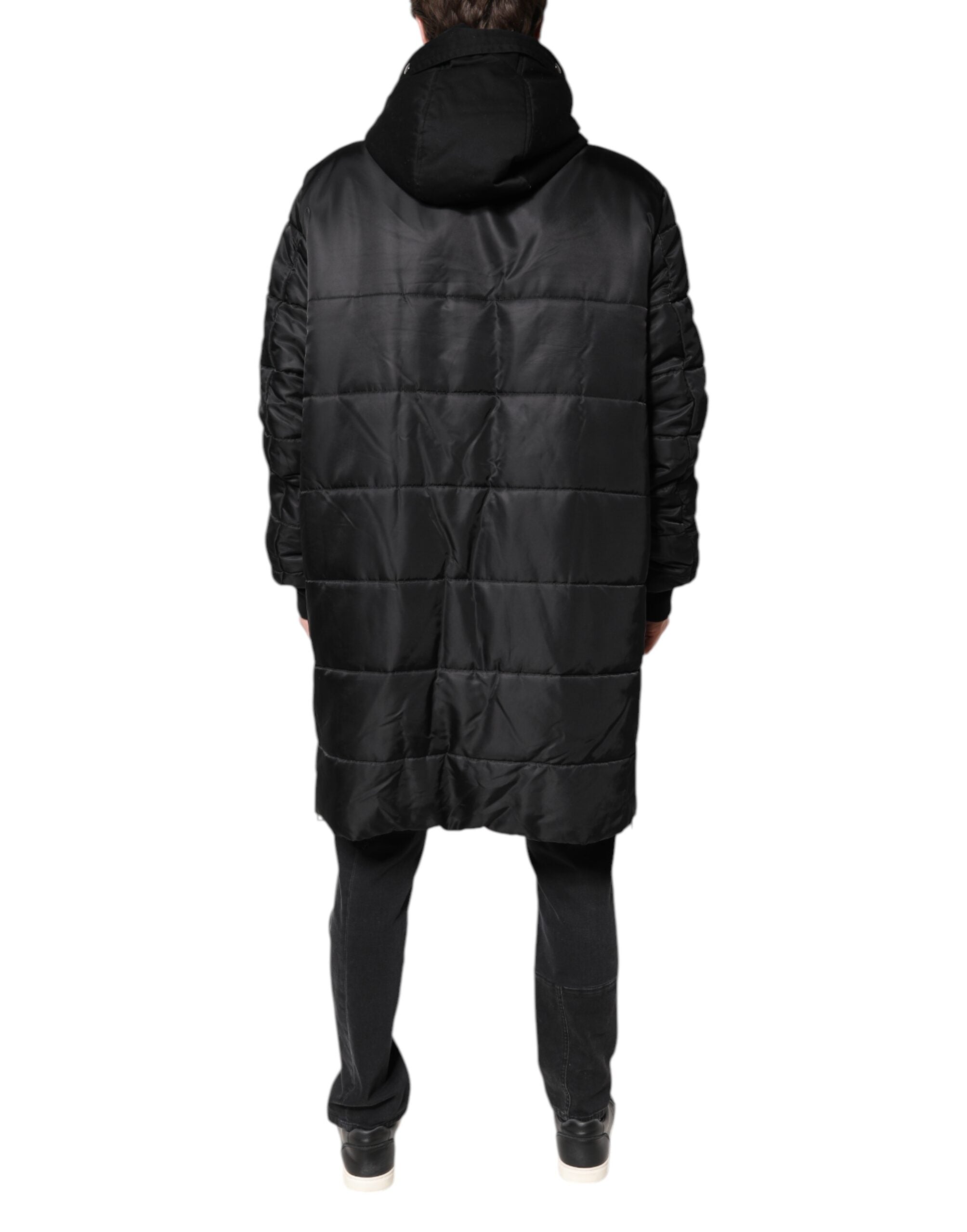 Indulge in the exquisite Dolce & Gabbana Black Hooded Parka, a timeless blend of luxury and sophistication crafted in Italy, perfect for the discerning individual.
