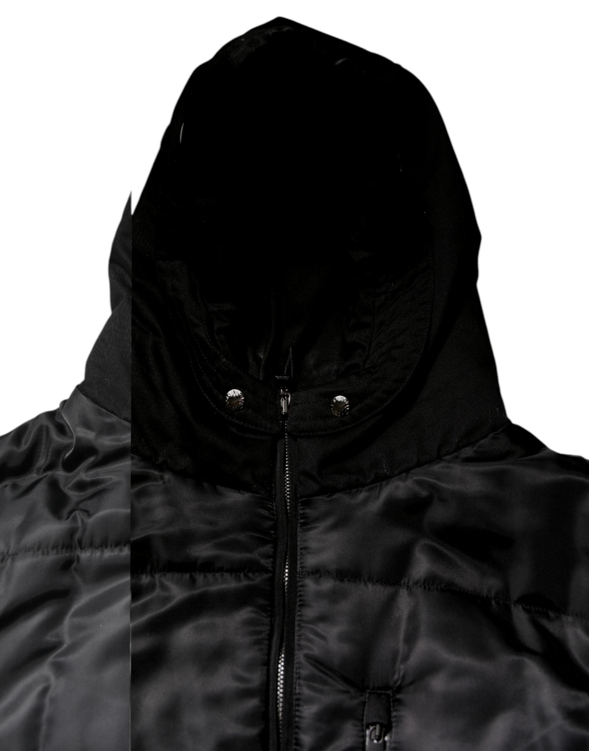 Elevate your winter wardrobe with the Dolce & Gabbana Black Hooded Parka, crafted in Italy from premium nylon and cotton, embodying timeless luxury and sophistication.