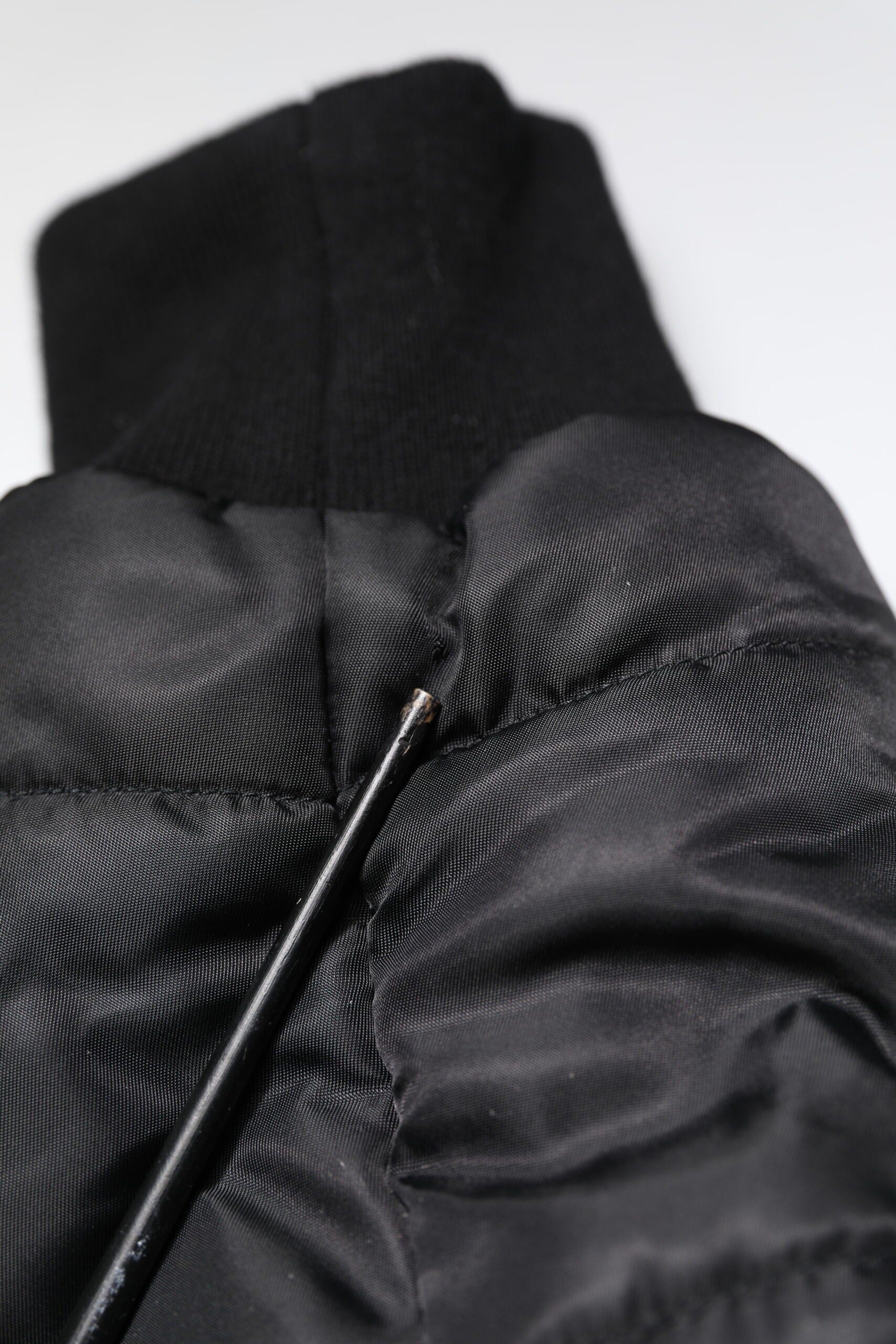 Indulge in the exquisite Dolce & Gabbana Black Hooded Parka, a luxurious blend of nylon and cotton, crafted in Italy for the discerning individual seeking timeless elegance.