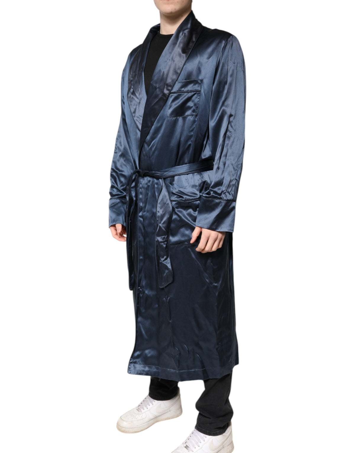 Experience the allure of the Dolce & Gabbana Blue Solid Silk Men Wrap Robe Coat Jacket, a testament to Italian craftsmanship and timeless elegance, perfect for the discerning individual.