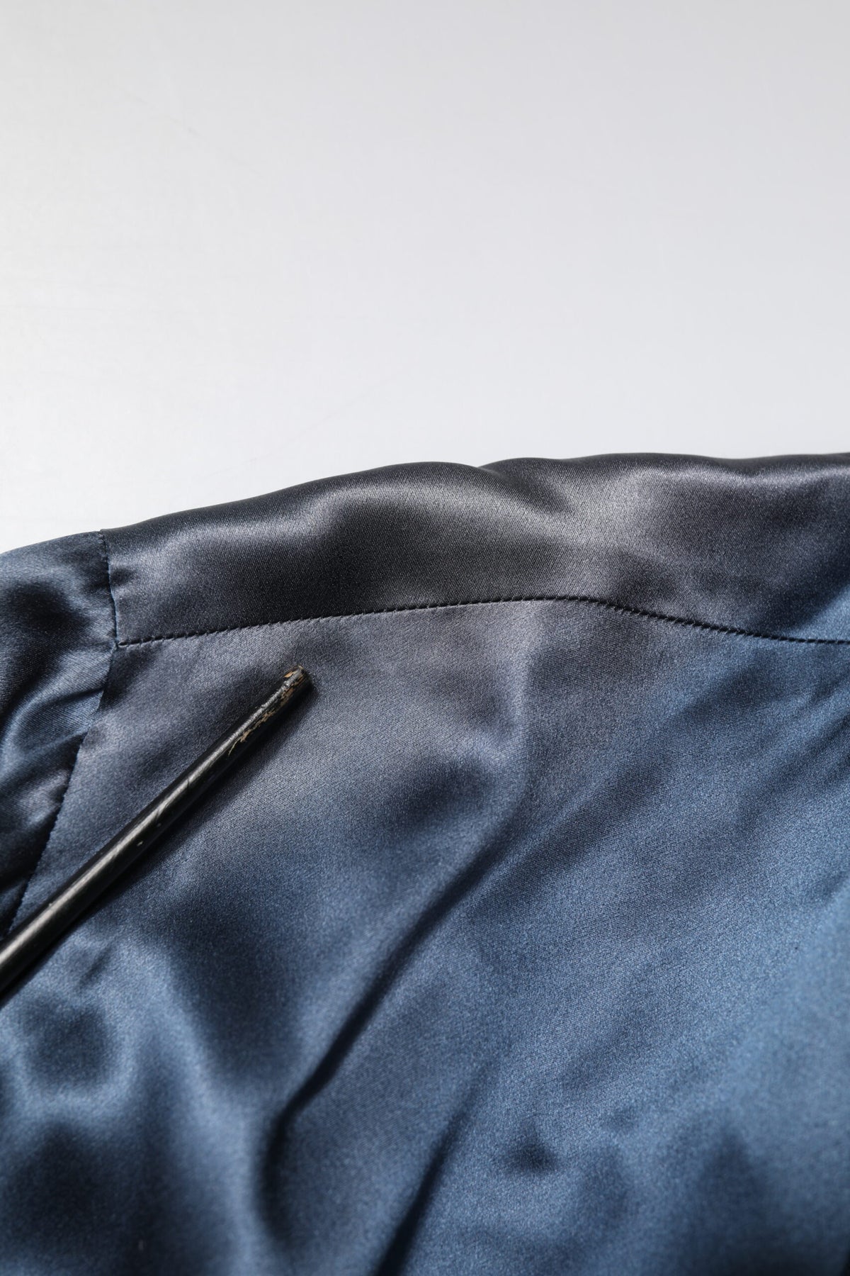 Indulge in the exquisite Dolce & Gabbana Blue Solid Silk Men Wrap Robe Coat Jacket, a testament to Italian craftsmanship that elevates your style with luxurious comfort and timeless elegance.