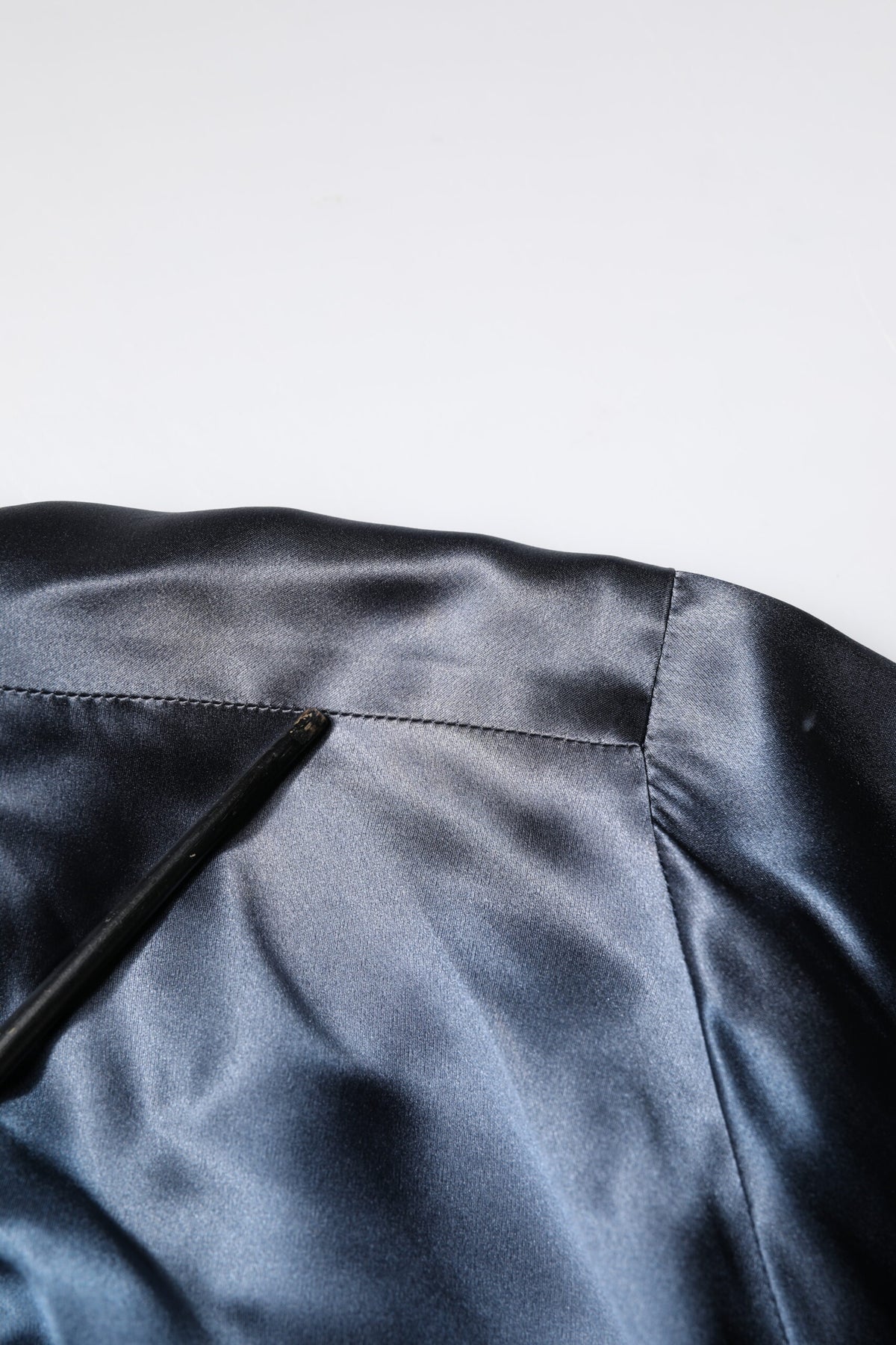 Indulge in the exquisite Dolce & Gabbana Blue Solid Silk Men Wrap Robe Coat Jacket, a timeless piece crafted in Italy that elevates your style with luxurious comfort and sophistication.