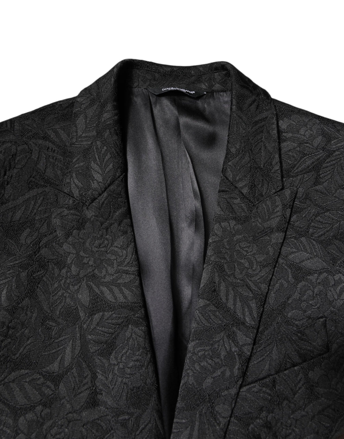 Elevate your wardrobe with the Dolce & Gabbana Black MARTINI Brocade Blazer, a masterpiece of Italian craftsmanship that embodies timeless elegance and sophistication.