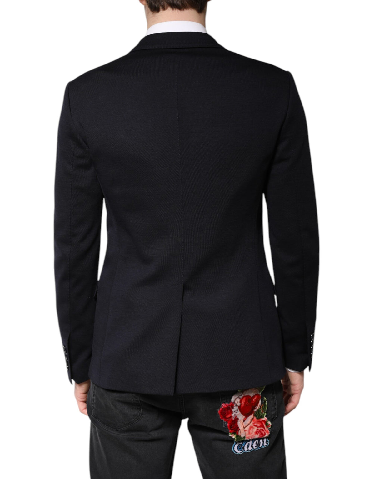 Indulge in the exquisite Dolce & Gabbana Black Wool Single Breasted Coat Suit Blazer, a timeless masterpiece crafted from luxurious virgin wool and silk, embodying elegance and sophistication for the discerning individual.