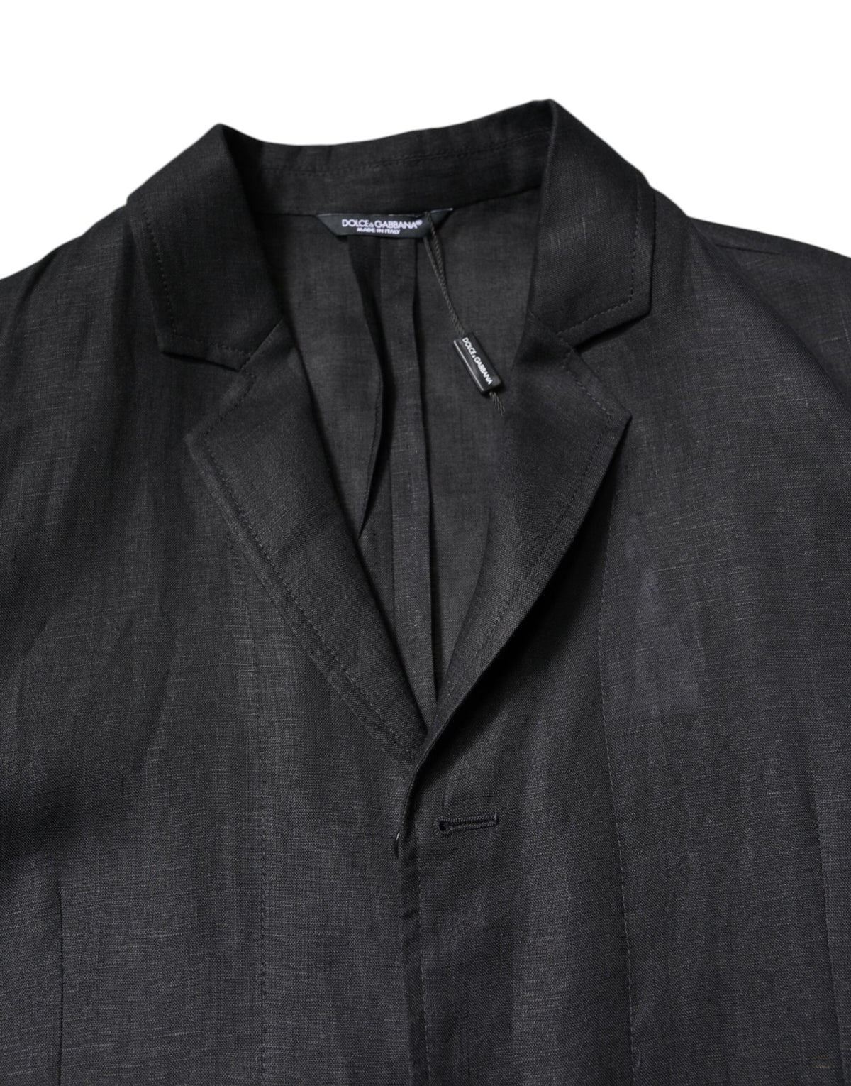 Experience the allure of Dolce & Gabbana's Black Linen Single Breasted Men Coat Blazer, a testament to Italian craftsmanship and timeless elegance, perfect for the discerning connoisseur.