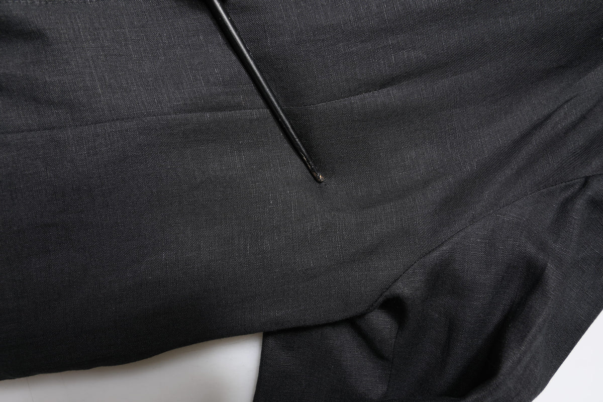 Experience the exquisite allure of Dolce & Gabbana's Black Linen Single Breasted Men Coat Blazer, a testament to Italian craftsmanship and timeless elegance.
