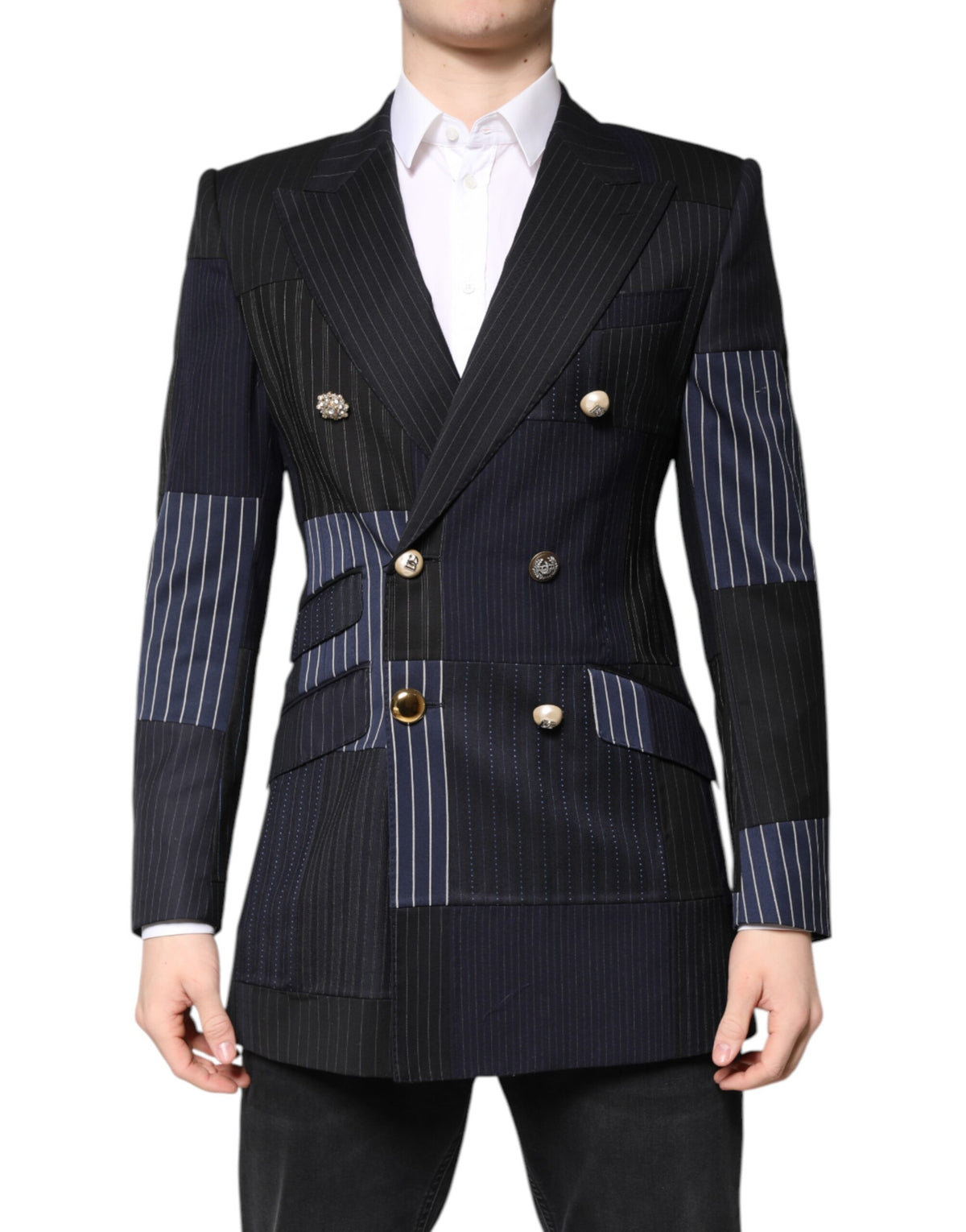 Elevate your style with the Dolce & Gabbana Multicolor Patchwork Blazer, a luxurious blend of virgin wool and silk, crafted in Italy for the discerning individual.
