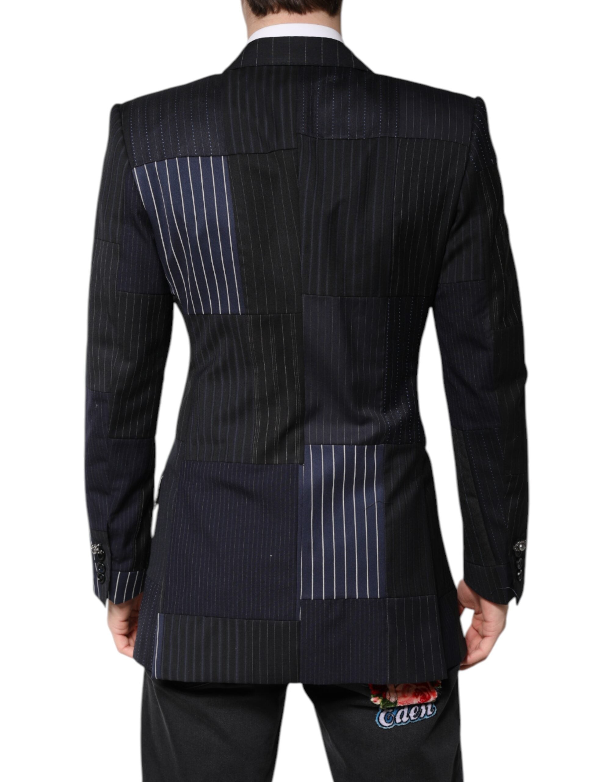 Indulge in the exquisite Dolce & Gabbana Multicolor Patchwork Jacket, where luxurious virgin wool and silk meet Italian craftsmanship for a statement of elegance and allure.