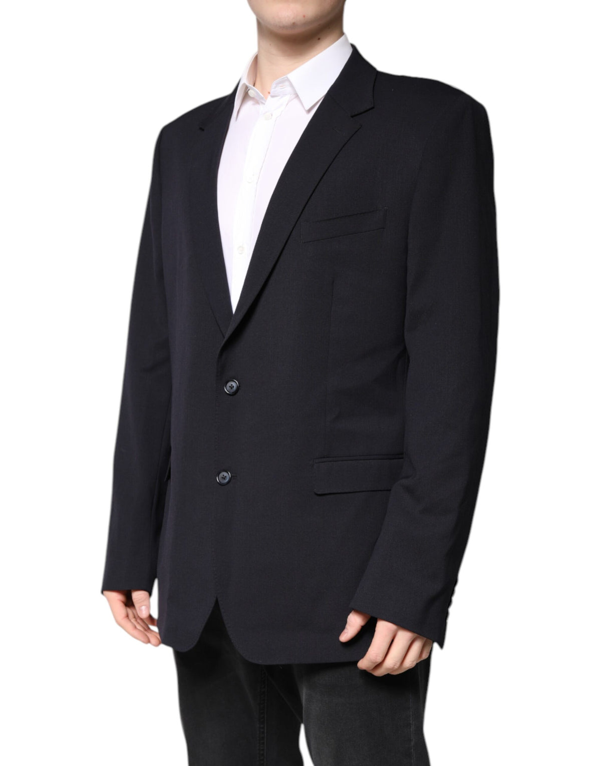 Indulge in the exquisite Dolce & Gabbana Dark Blue Wool Single Breasted Coat Blazer, a masterpiece of luxurious craftsmanship and timeless elegance, perfect for the discerning individual.