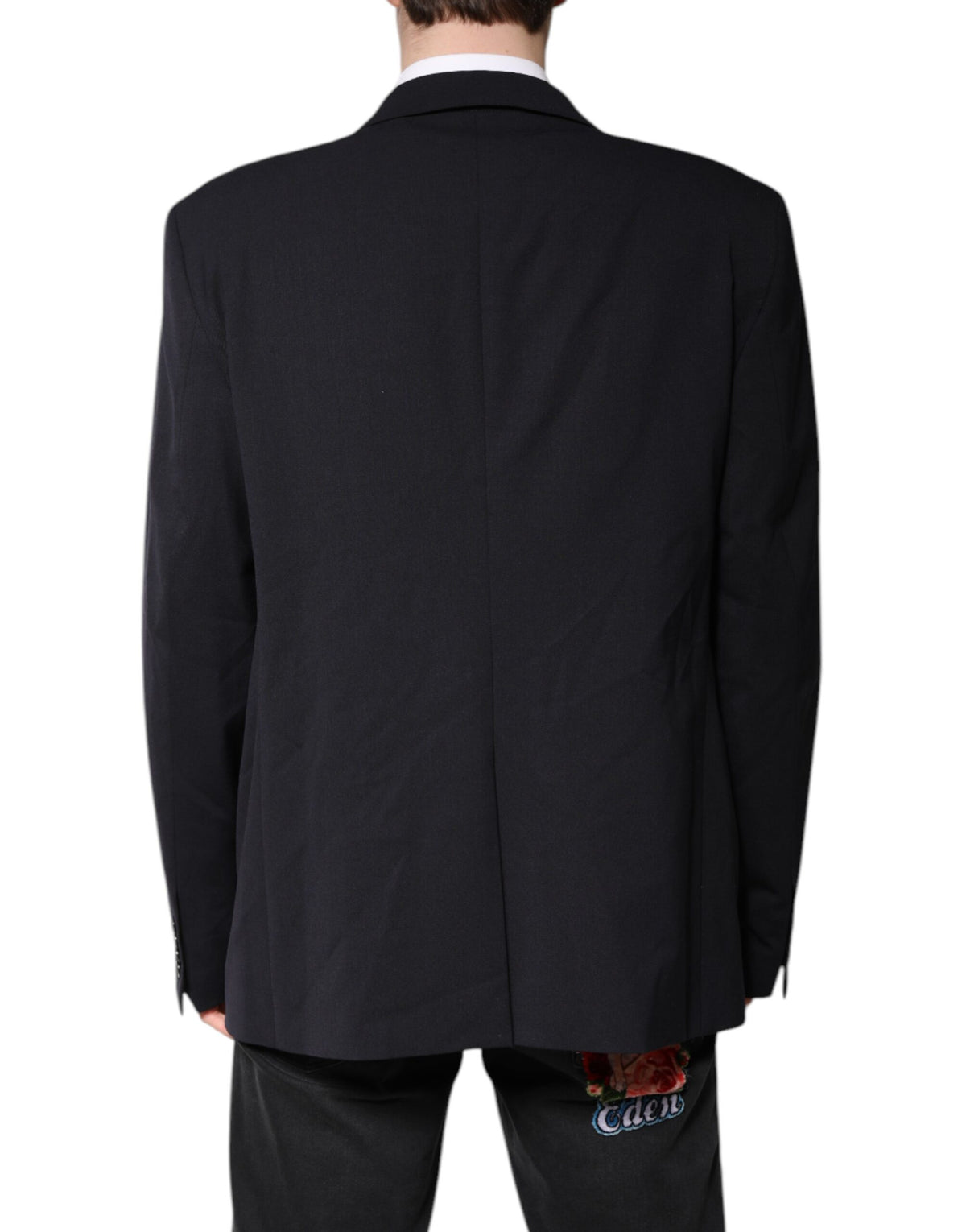 Discover the Dolce & Gabbana Dark Blue Wool Single Breasted Coat Blazer, a masterpiece of exquisite craftsmanship and luxurious materials, perfect for the discerning individual who embodies elegance and sophistication.