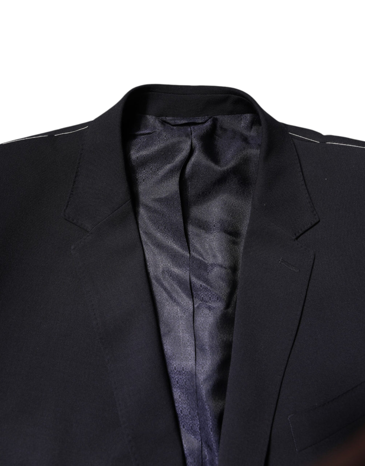 Discover the Dolce & Gabbana Dark Blue Wool Single Breasted Coat Blazer, a masterpiece of exquisite craftsmanship and luxurious materials, perfect for the discerning individual seeking timeless elegance.
