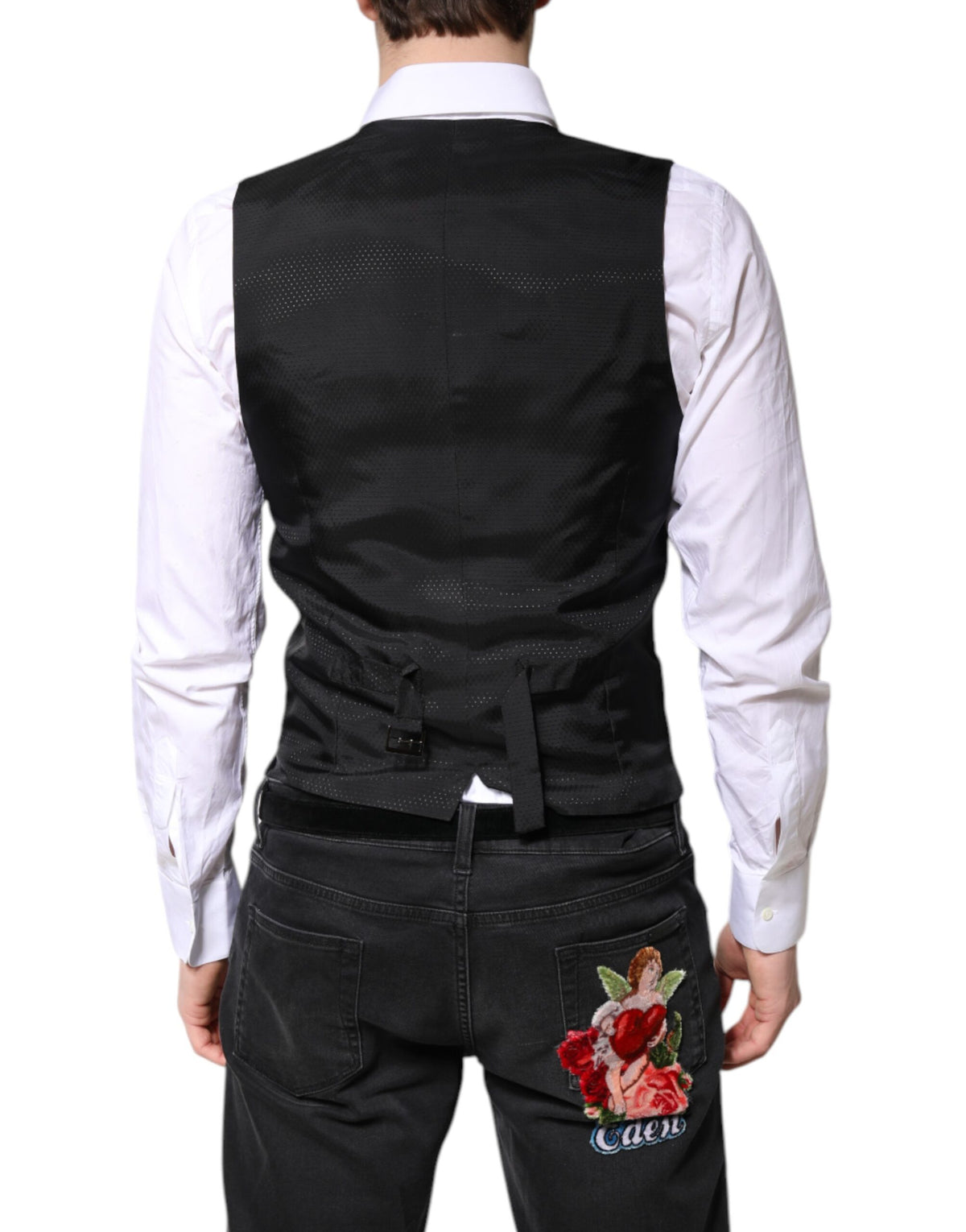 Elevate your elegance with the Dolce & Gabbana Black Wool Waistcoat Dress, crafted from a luxurious blend of virgin wool and silk for timeless sophistication.