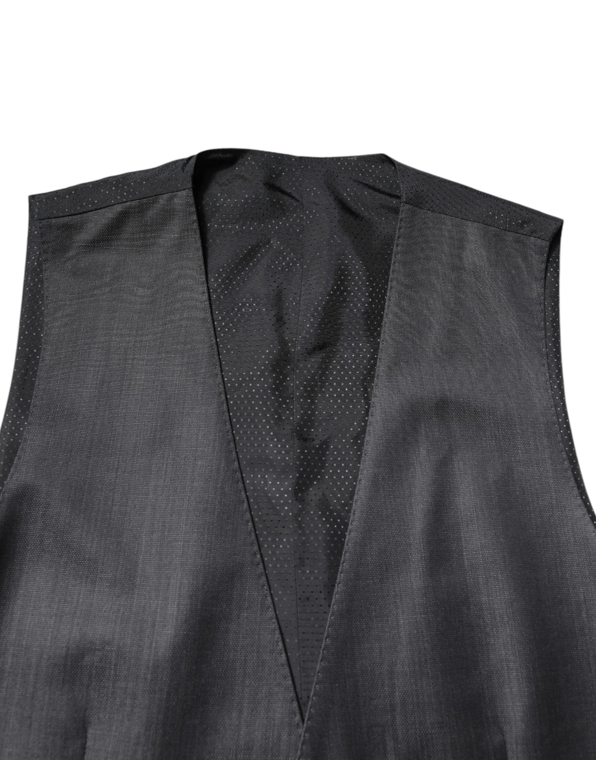 Elevate your wardrobe with the Dolce & Gabbana Black Wool Waistcoat Dress, crafted from a luxurious blend of virgin wool and silk for timeless sophistication and elegance.
