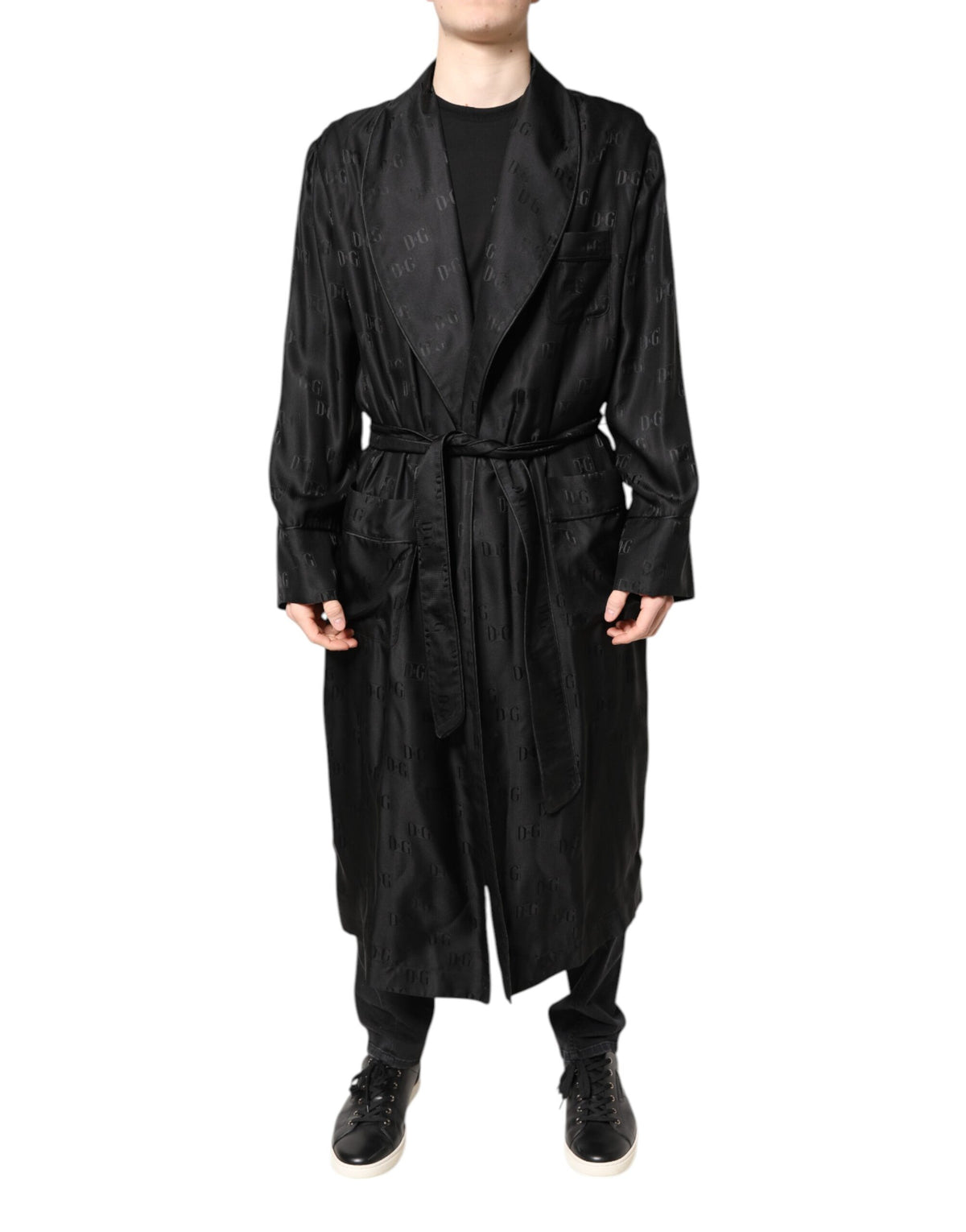Discover the Dolce & Gabbana Black Silk DG Logo Wrap Robe Jacket, a masterpiece of Italian craftsmanship that embodies timeless elegance and sophisticated allure.