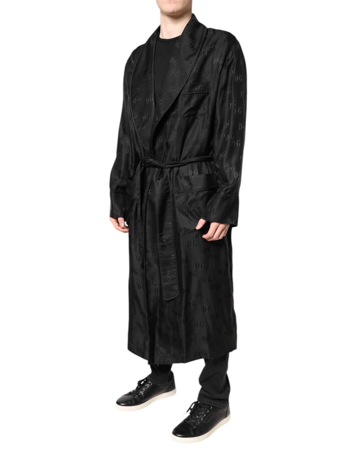 Indulge in the exquisite Dolce & Gabbana Black Silk DG Logo Wrap Robe Jacket, where Italian craftsmanship meets timeless elegance, perfect for the discerning connoisseur.