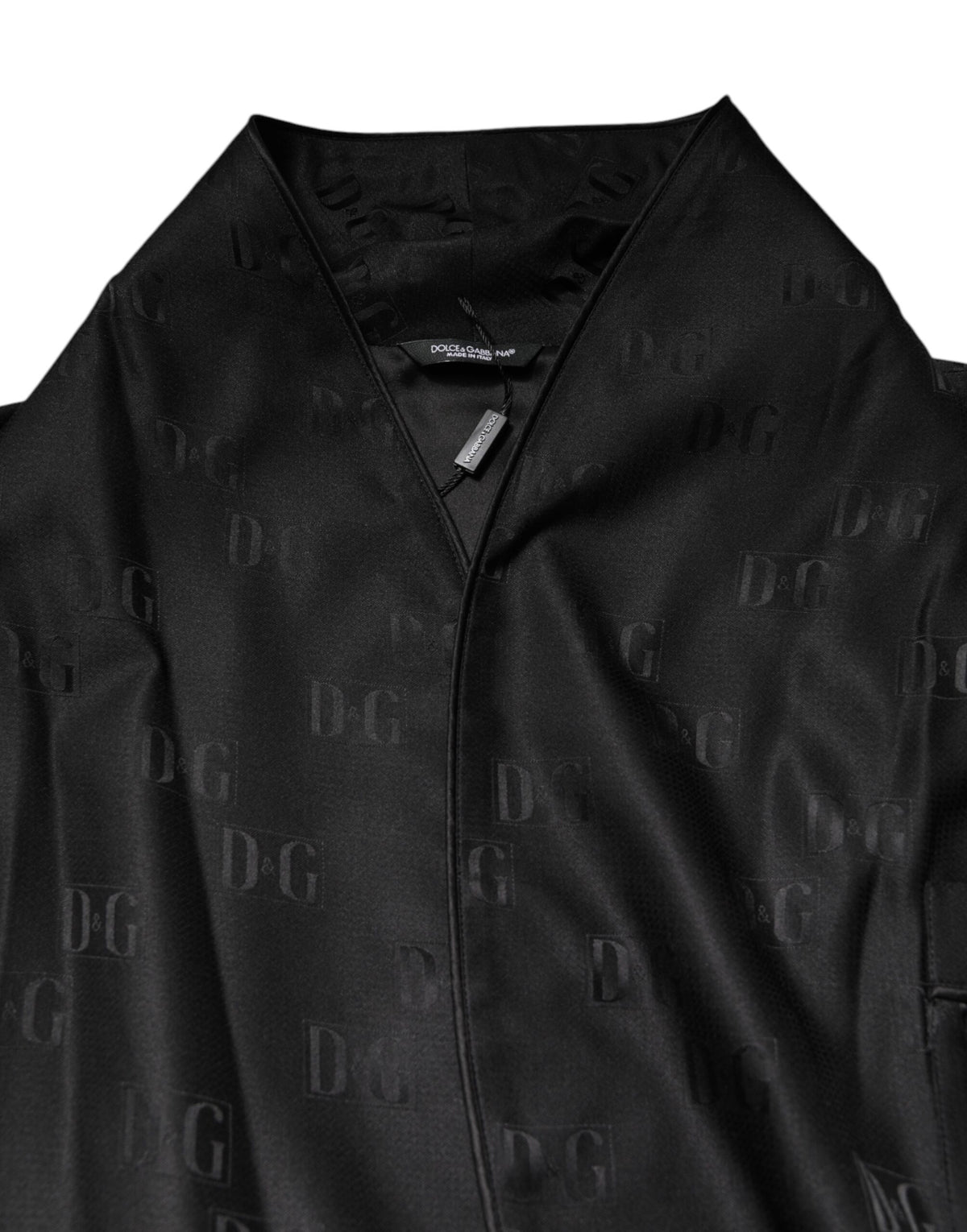 Elevate your wardrobe with the Dolce & Gabbana Black Silk DG Logo Wrap Robe Jacket, a masterpiece of Italian craftsmanship that embodies timeless elegance and luxurious comfort.