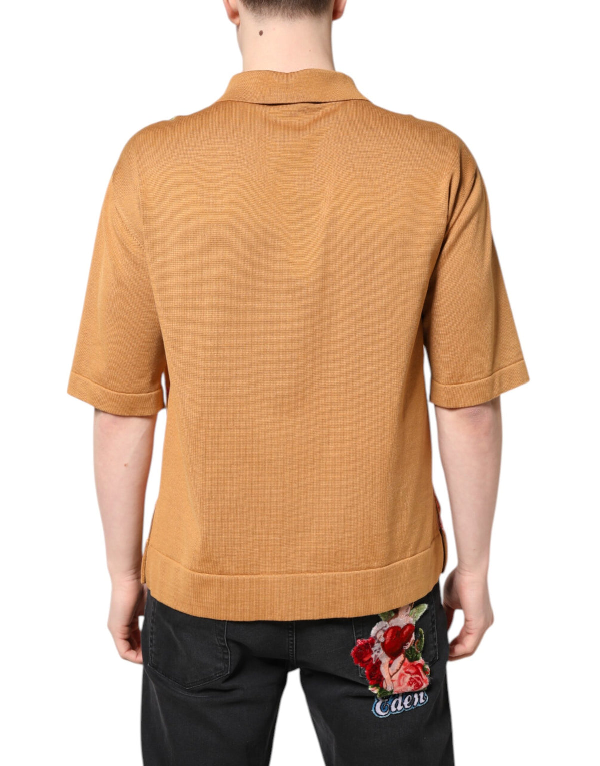 Indulge in the exquisite Dolce & Gabbana Brown Floral Collared Short Sleeve T-shirt, a silk masterpiece that embodies elegance and sophistication for the discerning individual.