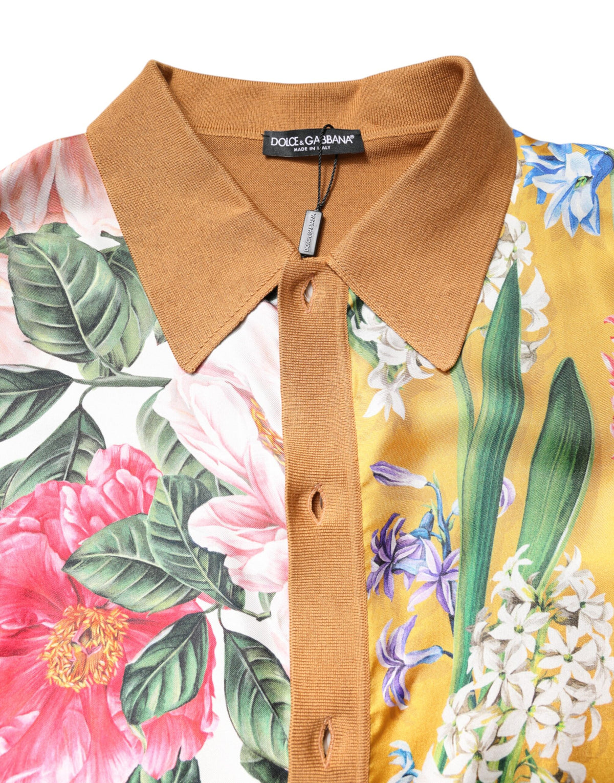 Indulge in the exquisite Dolce & Gabbana Brown Floral Collared Short Sleeve T-shirt, a silk masterpiece that embodies elegance and sophistication for the discerning individual.