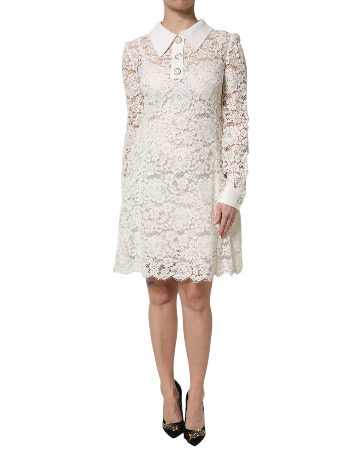 Indulge in the exquisite allure of the Dolce & Gabbana White Floral Lace Long Sleeves Shift Dress, a timeless masterpiece crafted in Italy for those who embody elegance and sophistication.