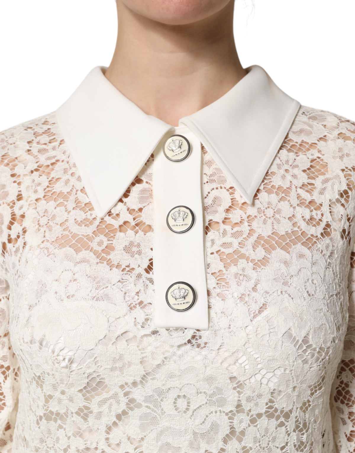 Indulge in the exquisite allure of the Dolce & Gabbana White Floral Lace Long Sleeves Shift Dress, a timeless masterpiece crafted in Italy for those who embrace luxury and sophistication.
