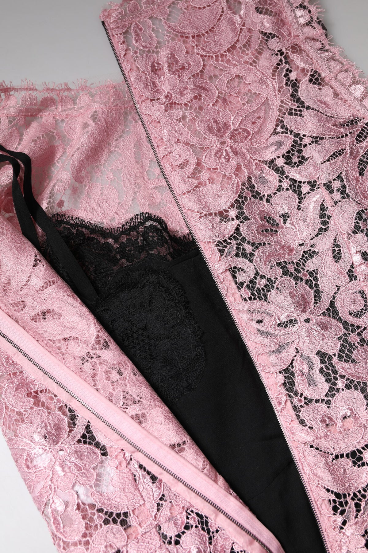 Indulge in the exquisite allure of the Dolce & Gabbana Pink Floral Lace Sleeveless Sheath Dress, a masterpiece of Italian craftsmanship that embodies timeless elegance and sensual sophistication.