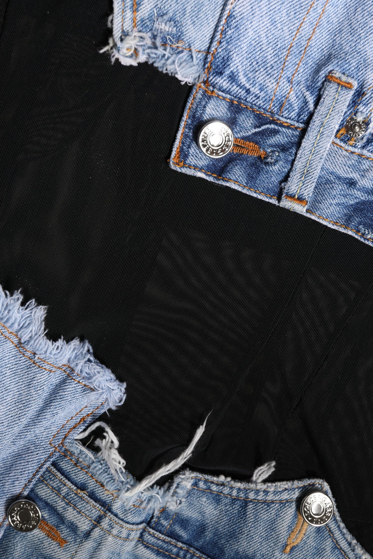 Indulge in the Dolce & Gabbana Black Blue Sleeveless Denim Mini Dress, a masterpiece of Italian craftsmanship that embodies luxury and timeless elegance for the discerning individual.