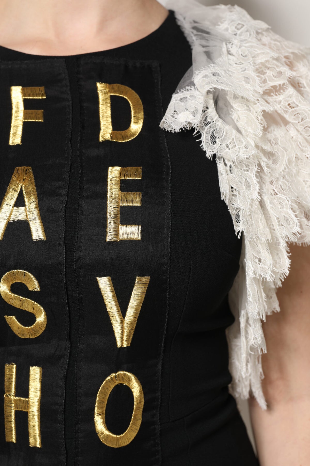 Indulge in the exquisite Dolce & Gabbana Black Fashion Devotion Embellish Mini Dress, a timeless masterpiece of luxurious fabrics and impeccable Italian craftsmanship, perfect for the discerning individual.