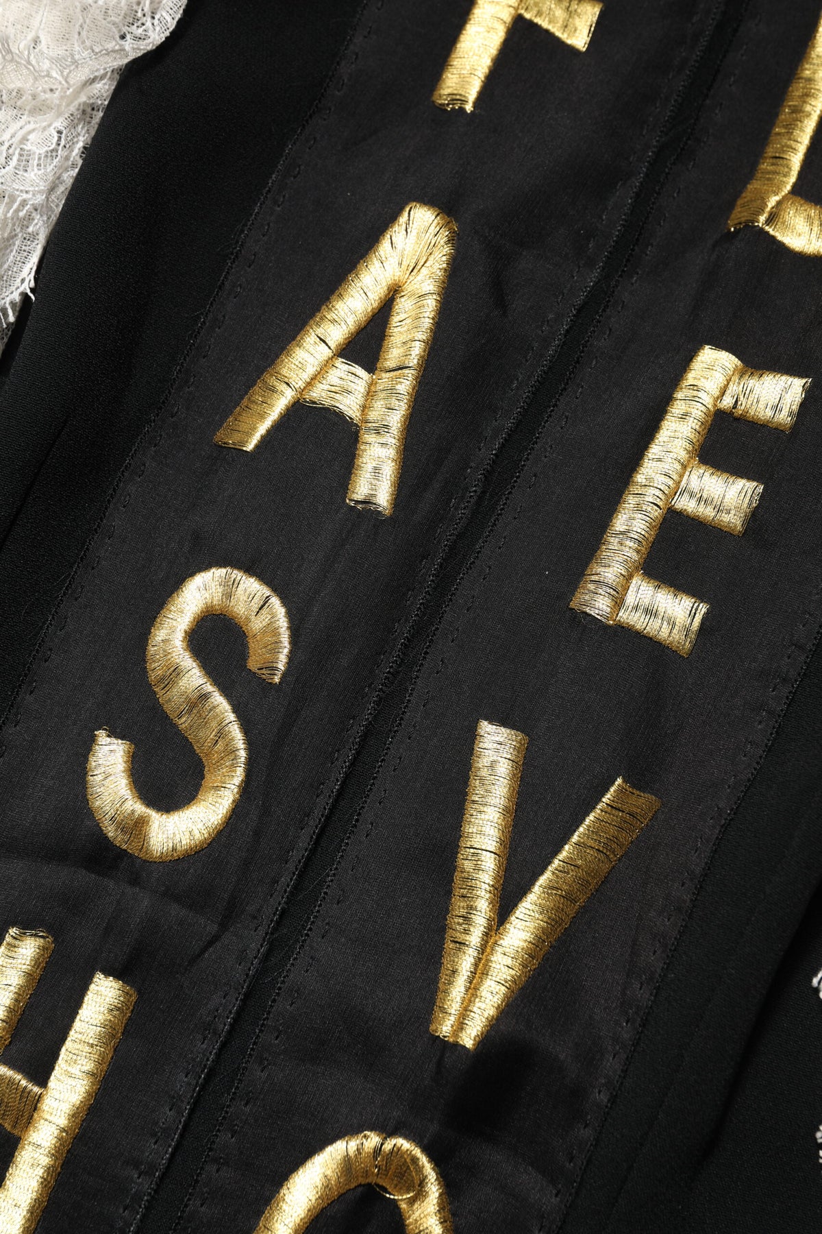 Indulge in the exquisite allure of the Dolce & Gabbana Black Fashion Devotion Embellish Mini Dress, a masterpiece of Italian craftsmanship that embodies timeless elegance and sensual sophistication.