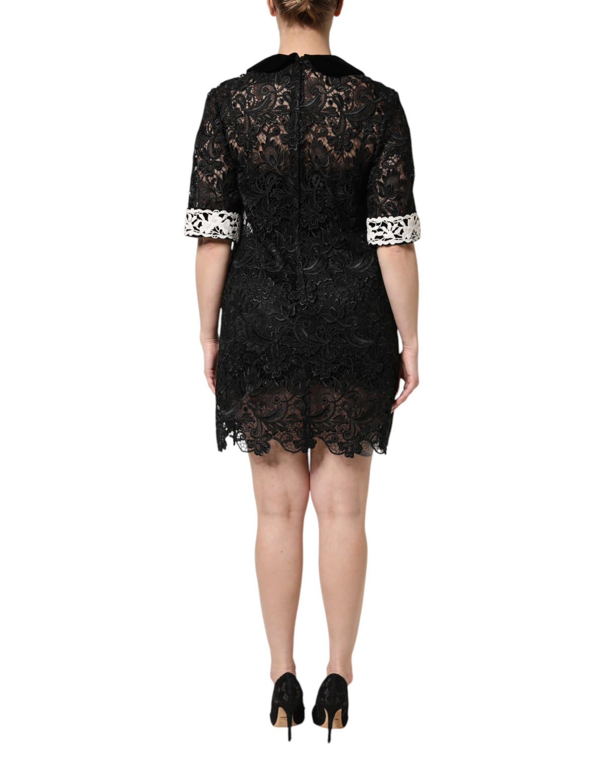 Indulge in the exquisite craftsmanship of the Dolce & Gabbana Black Floral Lace Embellished Mini Dress, a timeless piece that embodies luxury and sophistication for any occasion.