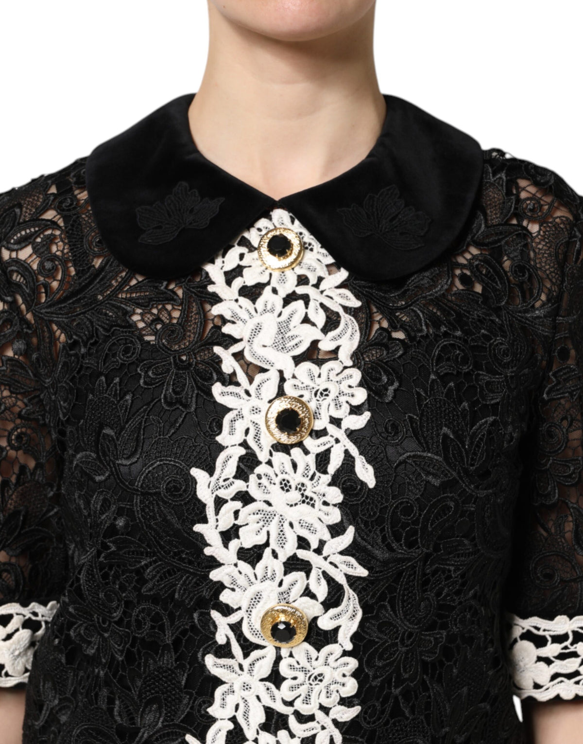 Indulge in the allure of the Dolce & Gabbana Black Floral Lace Embellished Mini Dress, where exquisite craftsmanship meets timeless elegance, perfect for any sophisticated occasion.