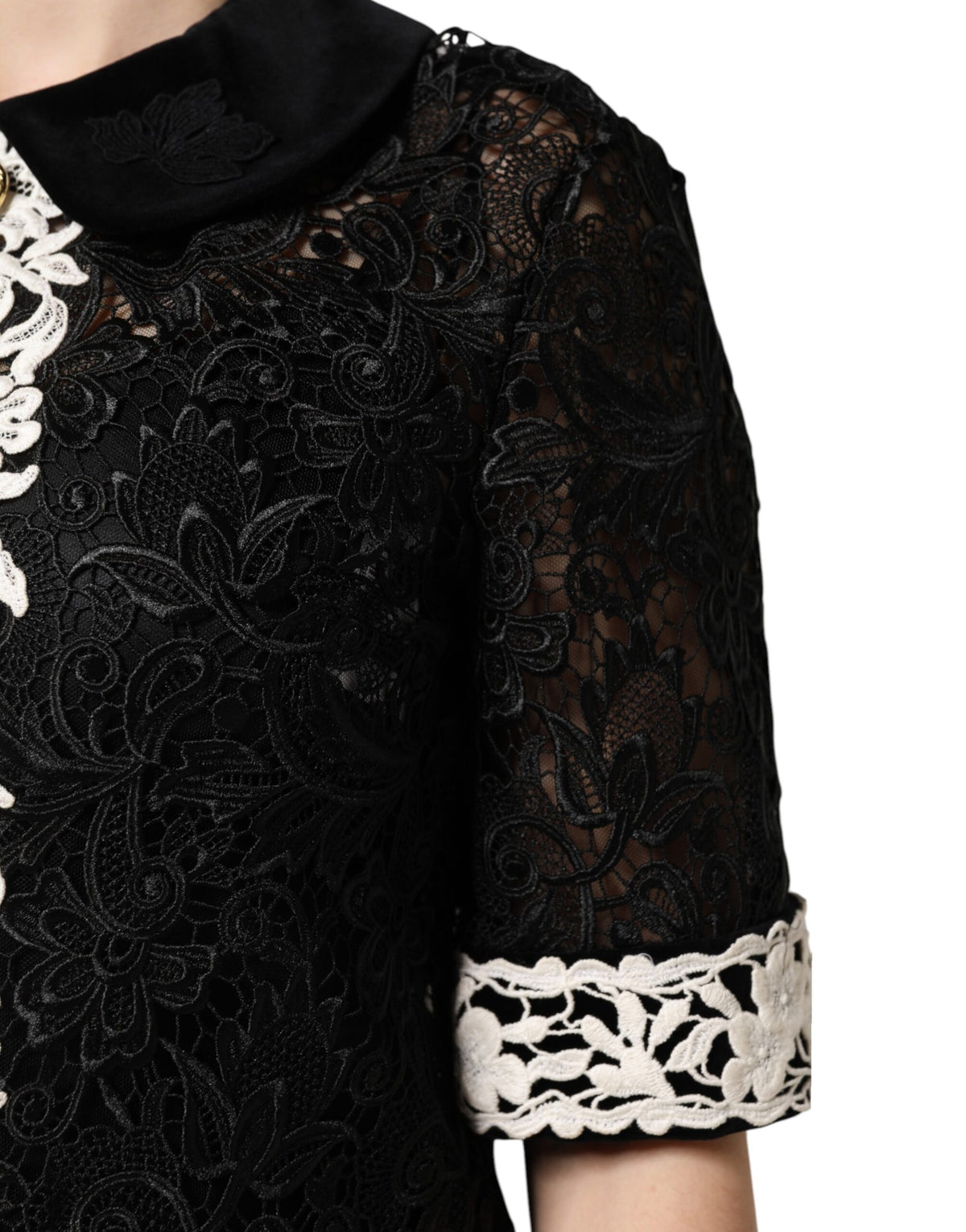 Experience the allure of the Dolce & Gabbana Black Floral Lace Embellished Mini Dress, a masterpiece of exquisite craftsmanship and luxurious materials, perfect for captivating elegance.