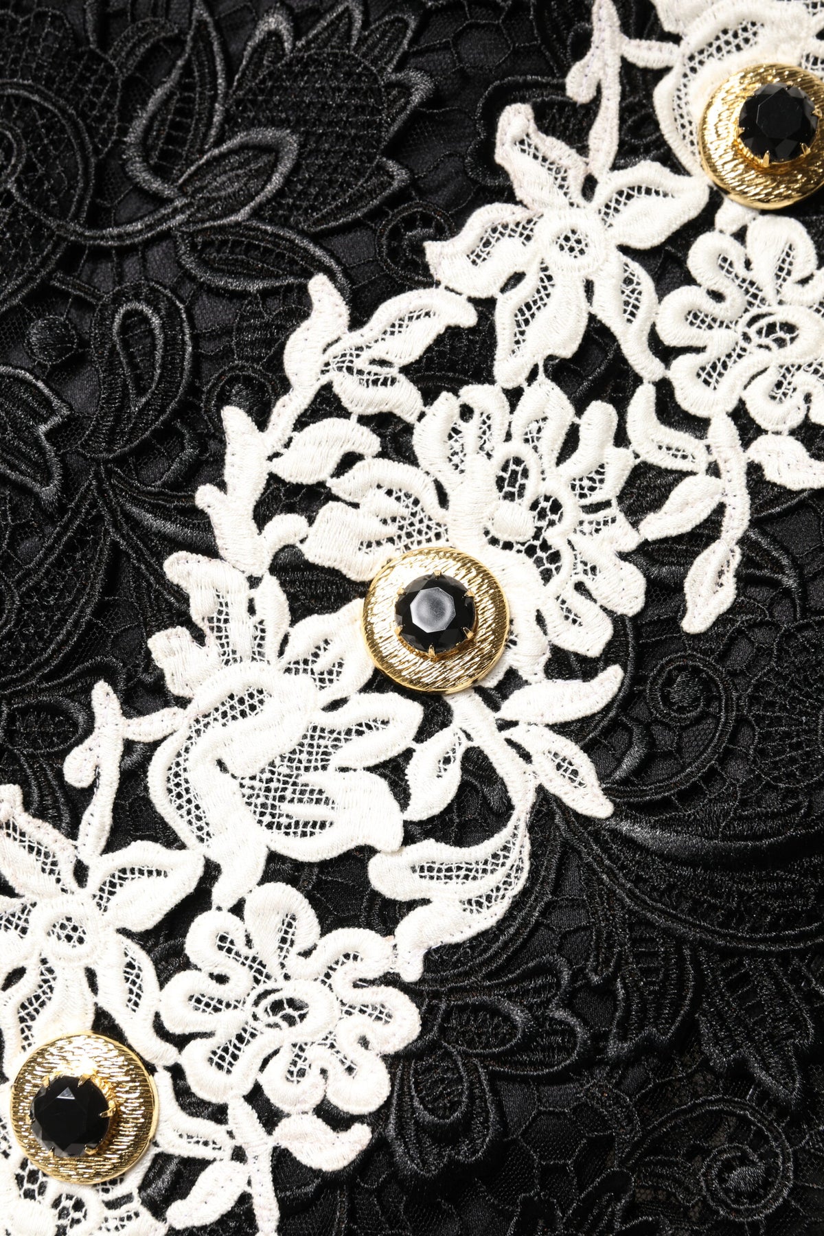 Indulge in the exquisite craftsmanship of the Dolce & Gabbana Black Floral Lace Embellished Mini Dress, a timeless piece that embodies luxury and sophistication for any elegant occasion.