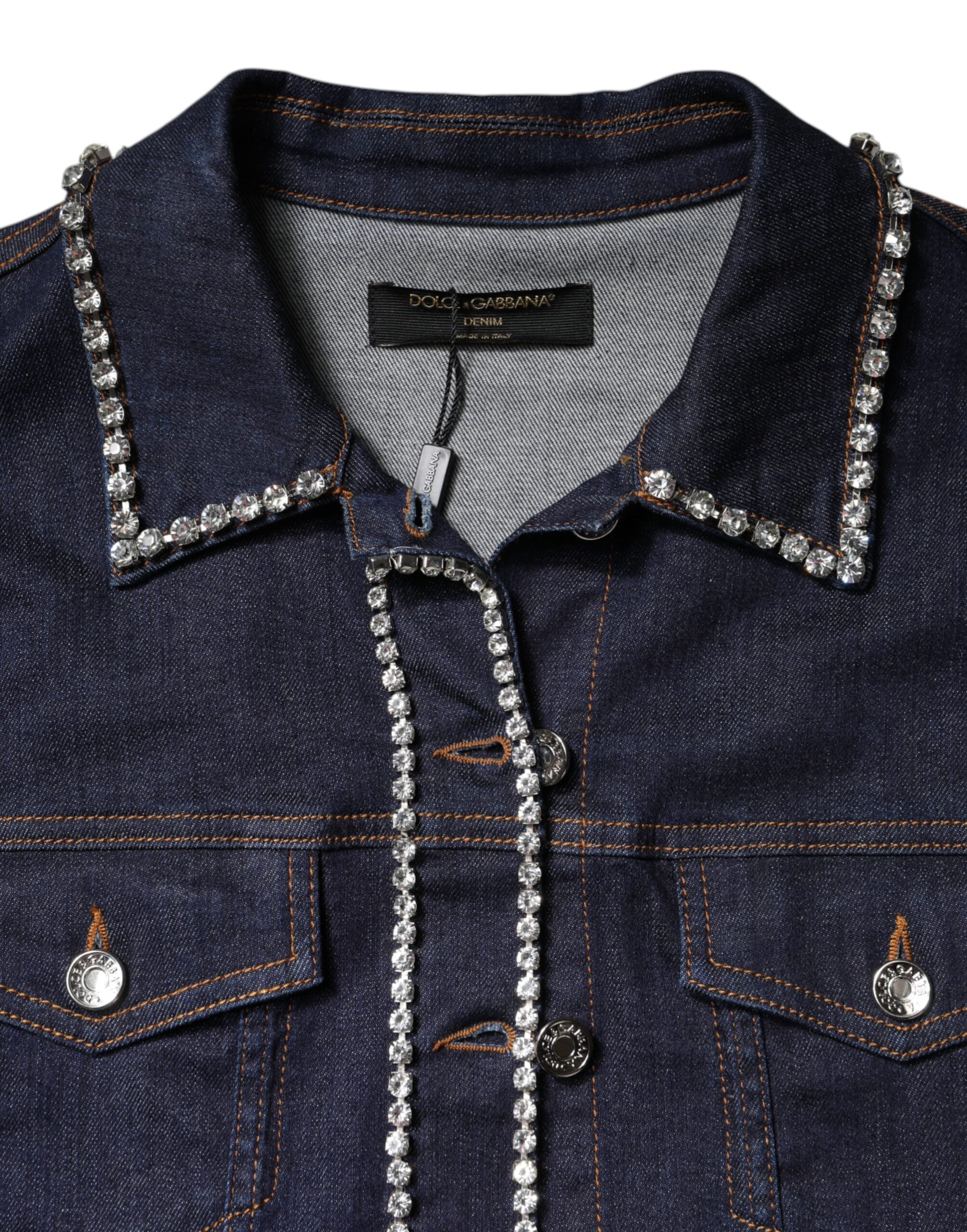 Elevate your wardrobe with the Dolce & Gabbana Blue Denim Cotton Crystal Embellished Jacket, a masterpiece of Italian craftsmanship that radiates timeless elegance and sophistication.