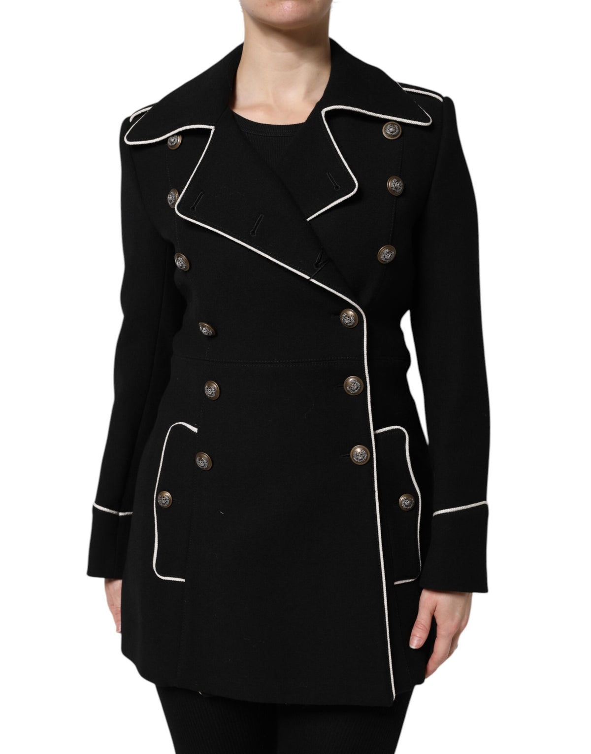 Elevate your wardrobe with the Dolce & Gabbana Black Wool Double Breasted Blazer, a timeless masterpiece of exquisite craftsmanship and luxurious materials, perfect for any sophisticated occasion.