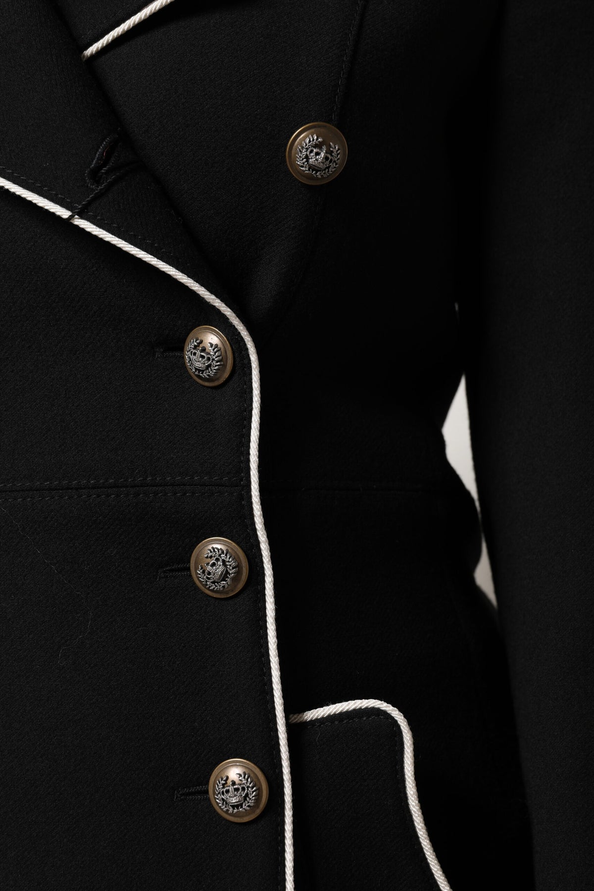 Indulge in the exquisite Dolce & Gabbana Black Wool Double Breasted Blazer, a timeless piece of luxury crafted from premium materials, embodying sophistication and elegance for the discerning individual.