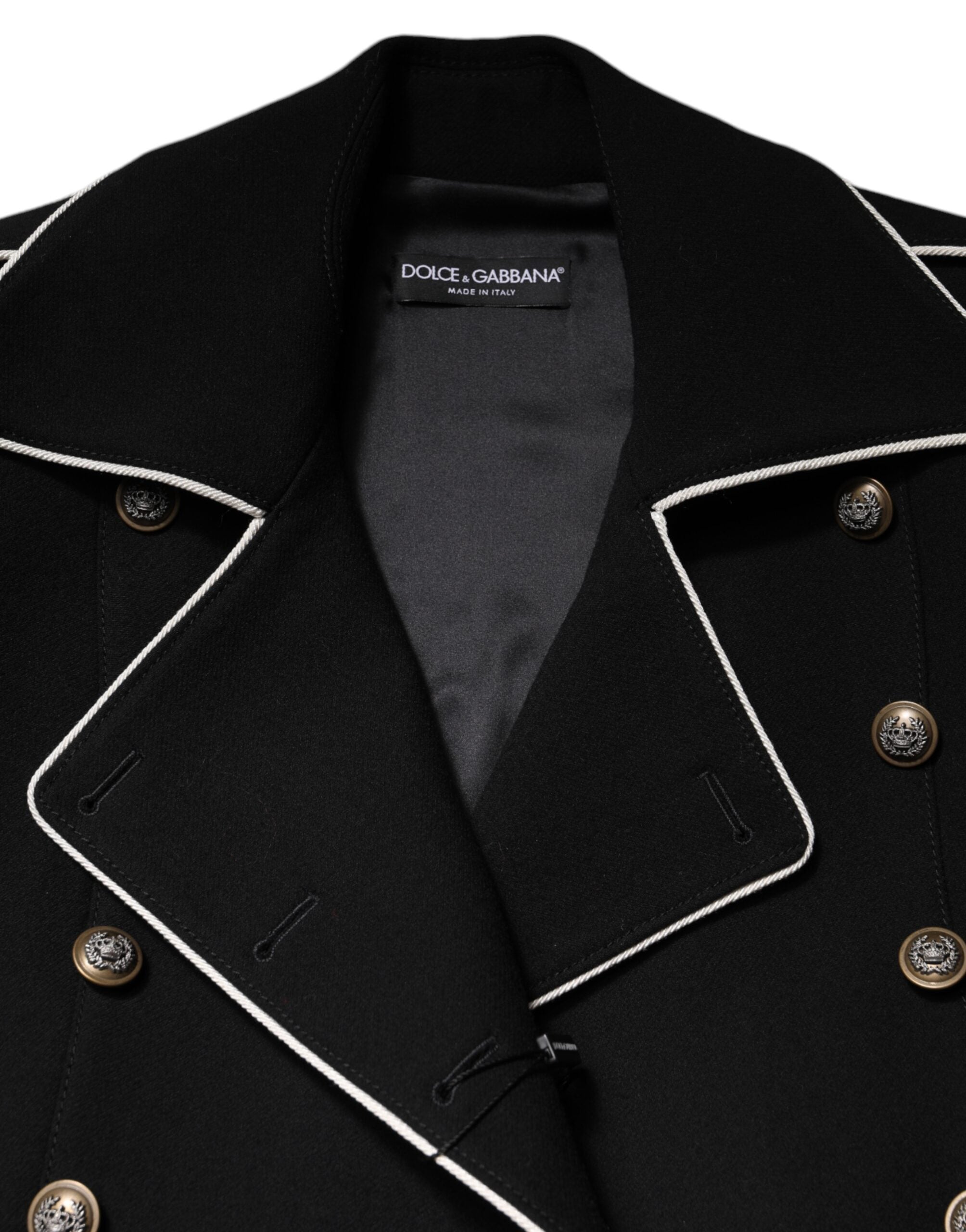 Discover the exquisite Dolce & Gabbana Black Wool Double Breasted Blazer, a timeless masterpiece crafted from luxurious virgin wool and silk, embodying elegance and sophistication.