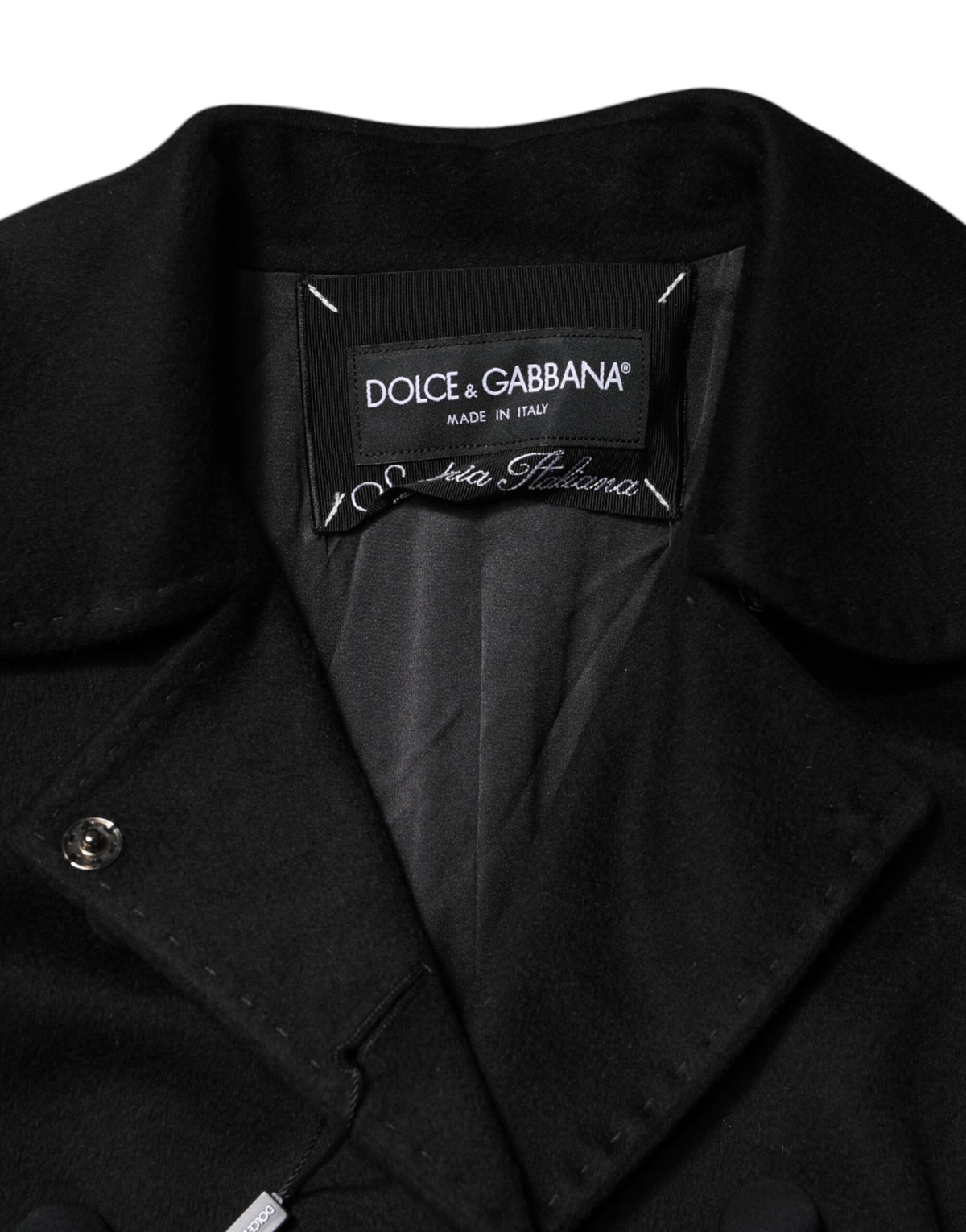 Indulge in the exquisite craftsmanship of the Dolce & Gabbana Black Wool Sartoria Italiano Blazer Jacket, a timeless piece that redefines luxury and elegance.