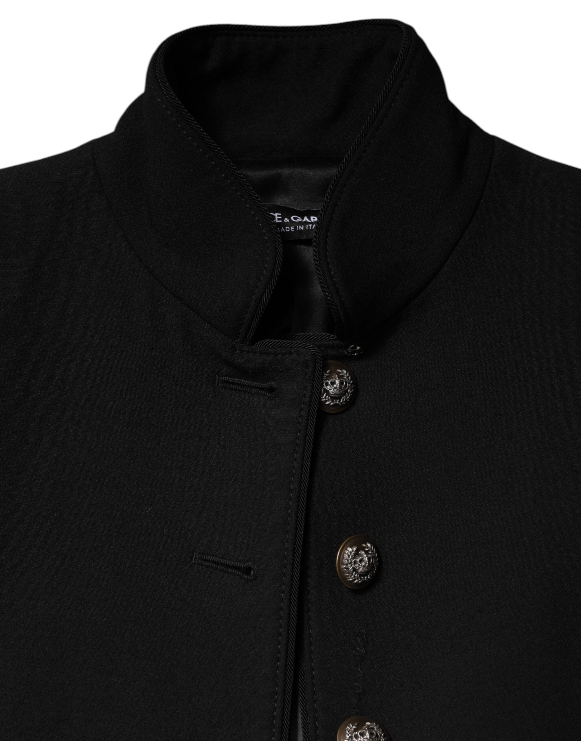 Experience the allure of the Dolce & Gabbana Black Wool Single Breasted Trench Coat, a masterpiece of Italian craftsmanship that embodies timeless elegance and sophistication.